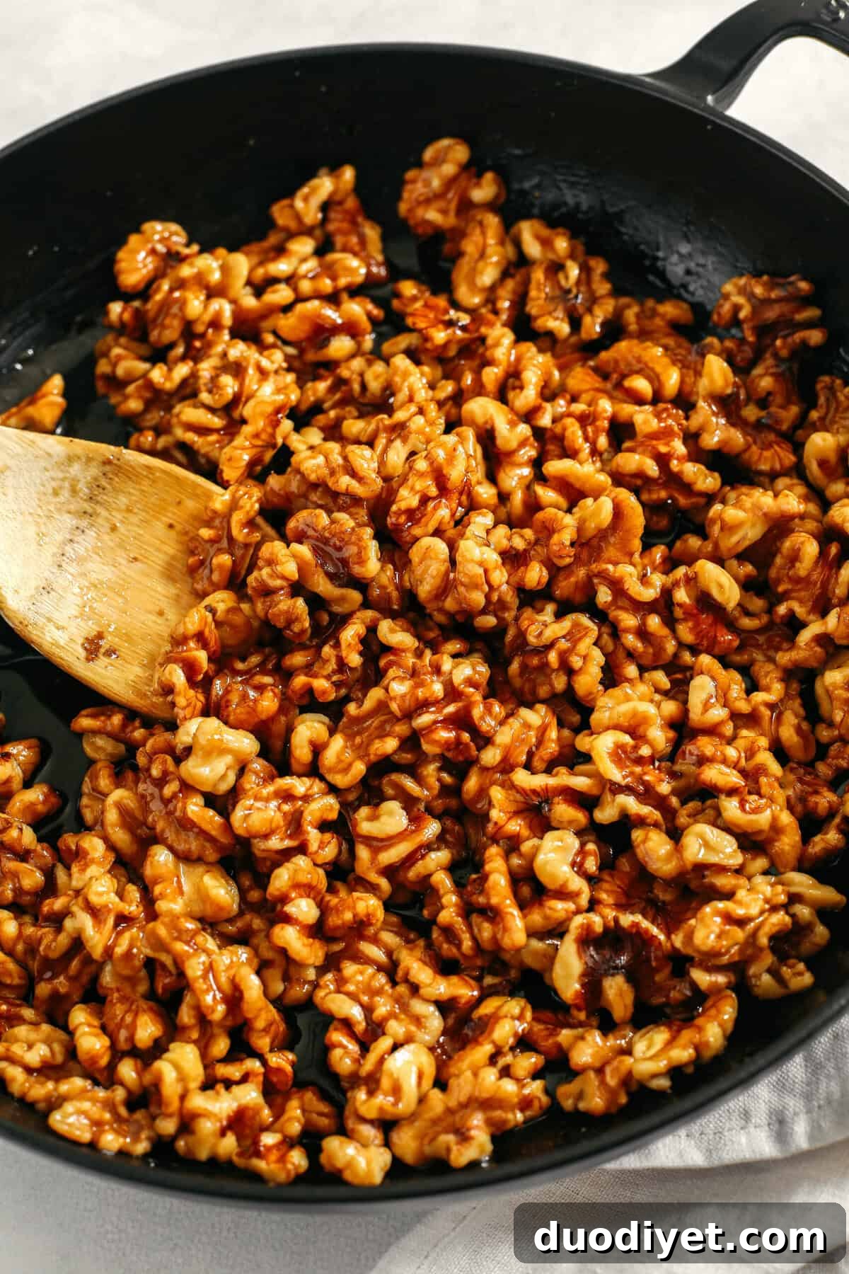 Sweet and crunchy Candied Maple Walnuts easily made in under 10 minutes with only 4 simple ingredients and naturally sweetened with maple syrup, vanilla and cinnamon!