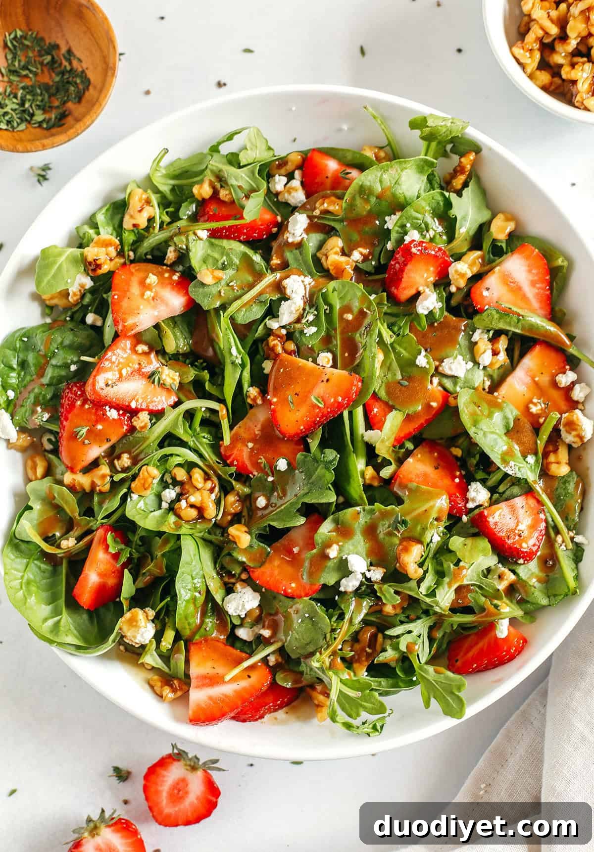 Strawberry salad close-up with maple balsamic vinaigrette