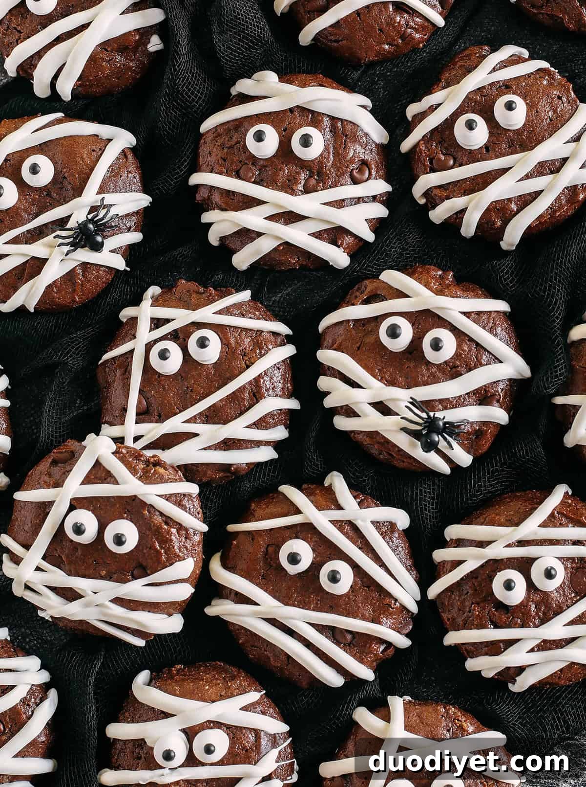 Halloween Chocolate Mummy Cookies 2 Get festive this Halloween with these delicious Chocolate Mummy Cookies! Made healthier with zero butter, oil or refined sugar and are the perfect spooky treat your kids will love!