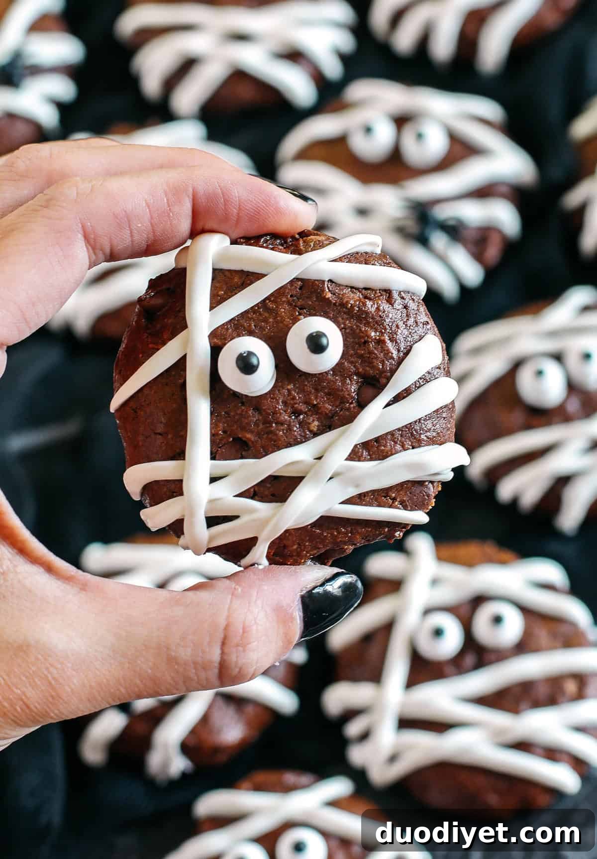 Halloween Chocolate Mummy Cookies 4 Get festive this Halloween with these delicious Chocolate Mummy Cookies! Made healthier with zero butter, oil or refined sugar and are the perfect spooky treat your kids will love!