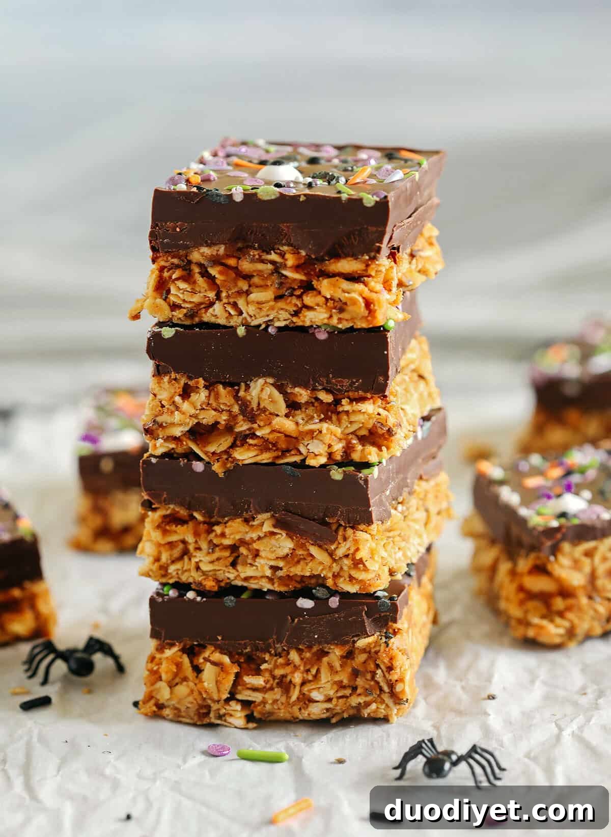 No-Bake Chocolate Pumpkin Bars Recipe 3 No Bake Chocolate Pumpkin Bars topped with dark chocolate and sprinkles