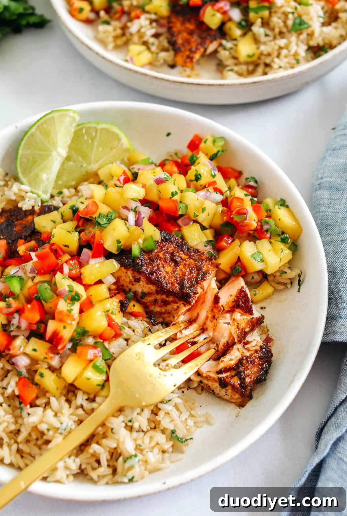 This tender flaky Chili Lime Salmon is coated in a delicious combination of spices and fresh lime juice for a mouthful of flavor! Pair it with fresh mango salsa and brown rice for the perfect healthy dinner!