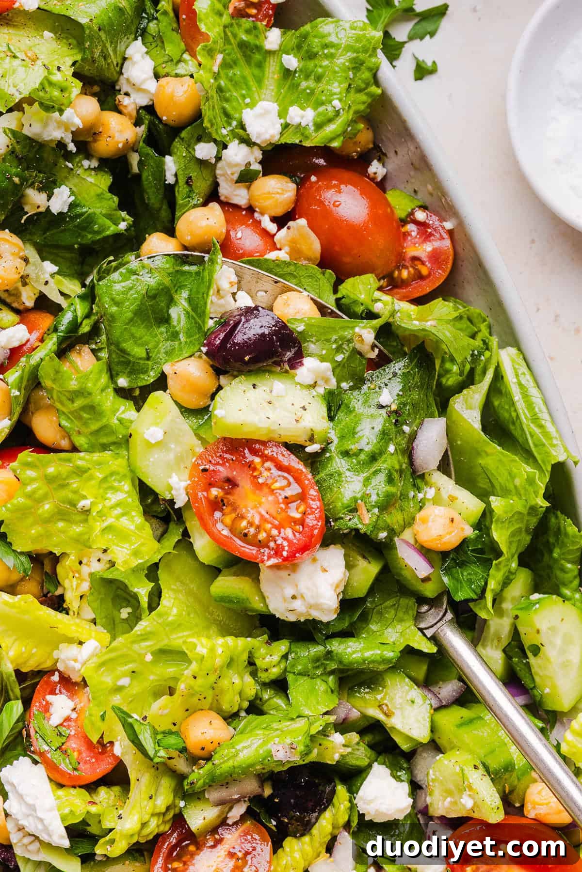 Mediterranean Chopped Salad with Feta, Olives and Lemon Dressing 8 Fresh and crisp Mediterranean Chopped Salad made with fresh tomatoes, crisp cucumbers, red onion, chickpeas, olives and feta cheese all tossed with a delicious red wine vinaigrette! Perfect for meal prep, lunches, or an easy side dish for any meal.