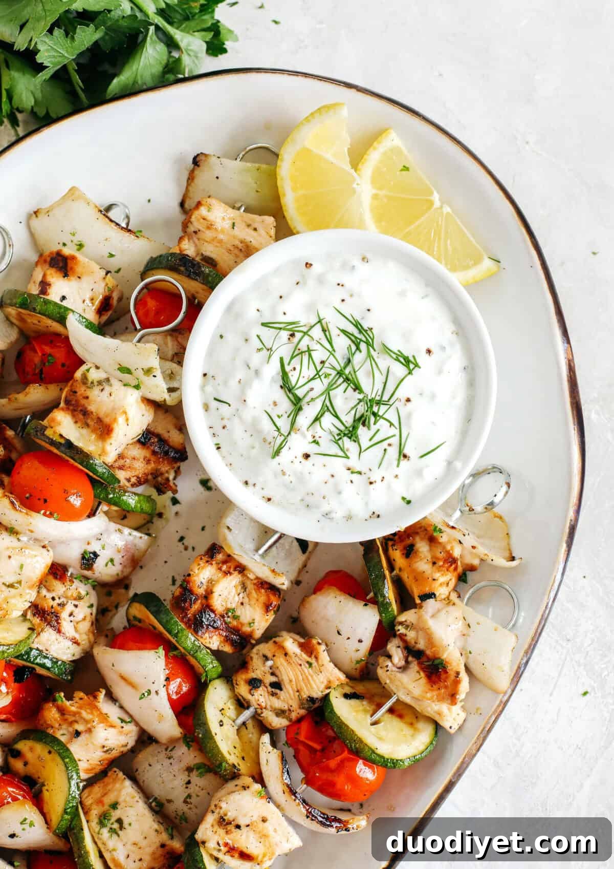 Fresh and flavorful Homemade Tzatziki Sauce is a creamy yogurt-based sauce perfect for the summer served with kabobs, grilled veggies, pita bread and more! This recipe is easily made in just 5 minutes with a few simple ingredients!