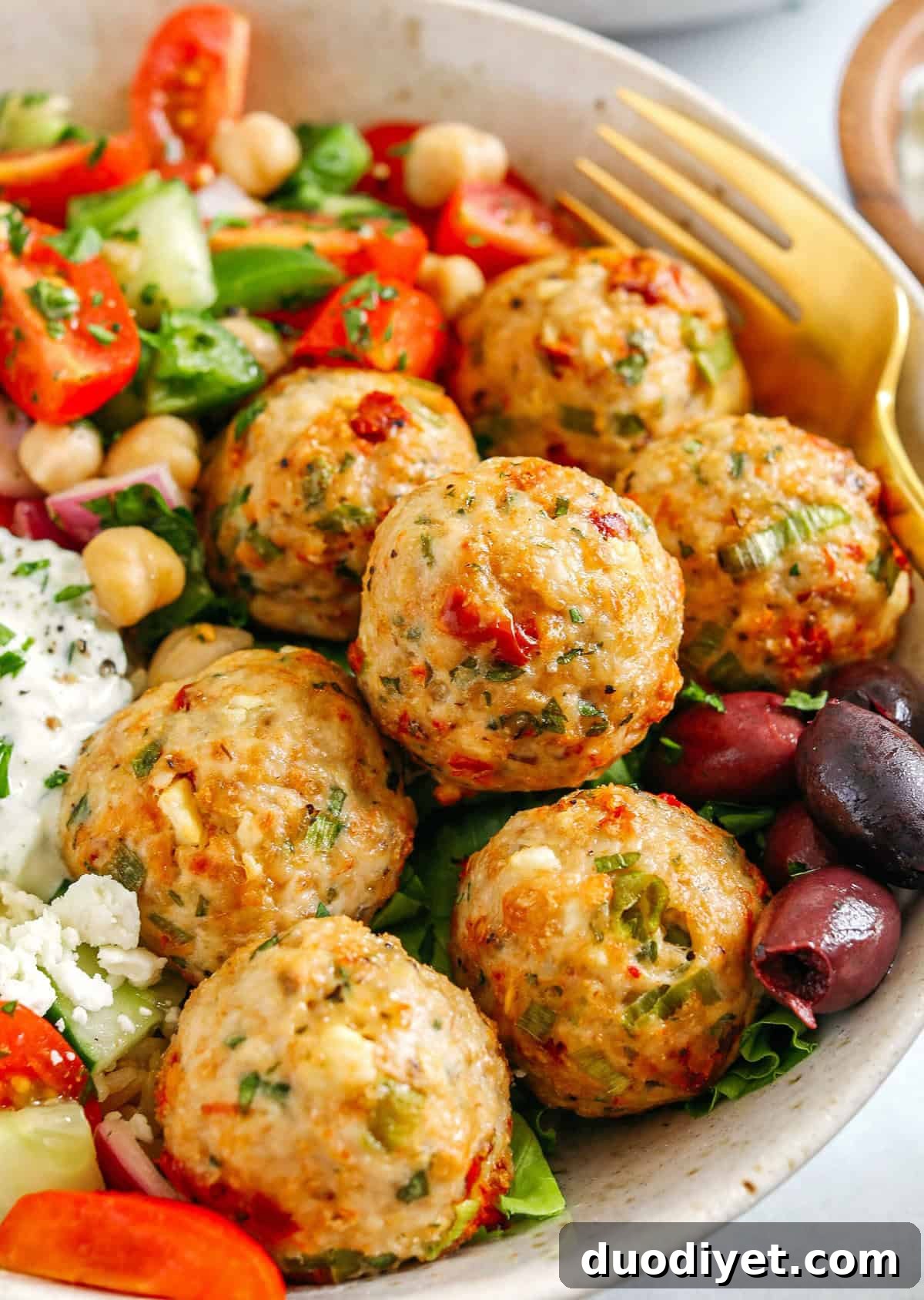 Baked Mediterranean Chicken Meatballs on a baking sheet