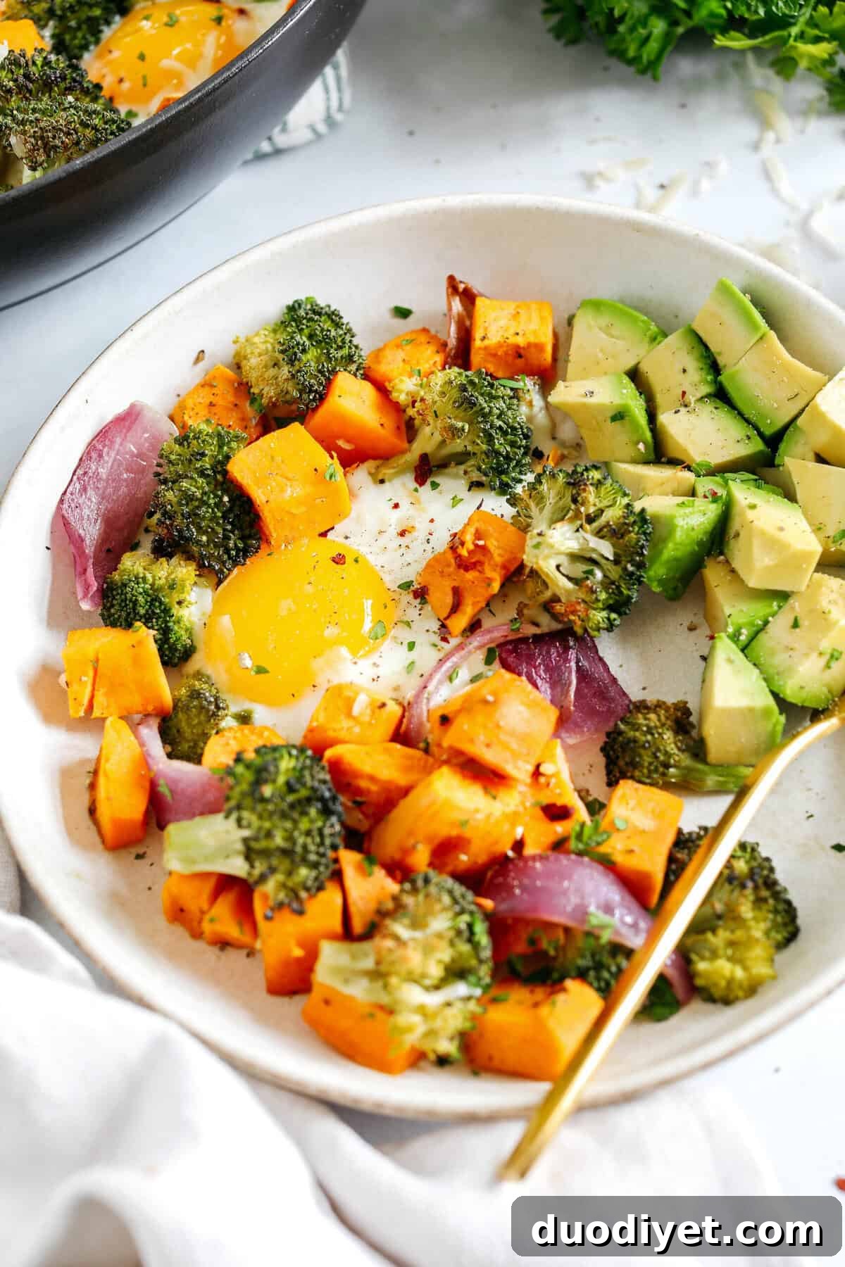 Savory Roasted Vegetable Breakfast Skillet with Eggs 5 Roasted Veggie Breakfast Skillet made all in one pan with a hearty combination of sweet potatoes, broccoli and red onion topped with baked eggs and seasoned to perfection for a healthy delicious breakfast or dinner!