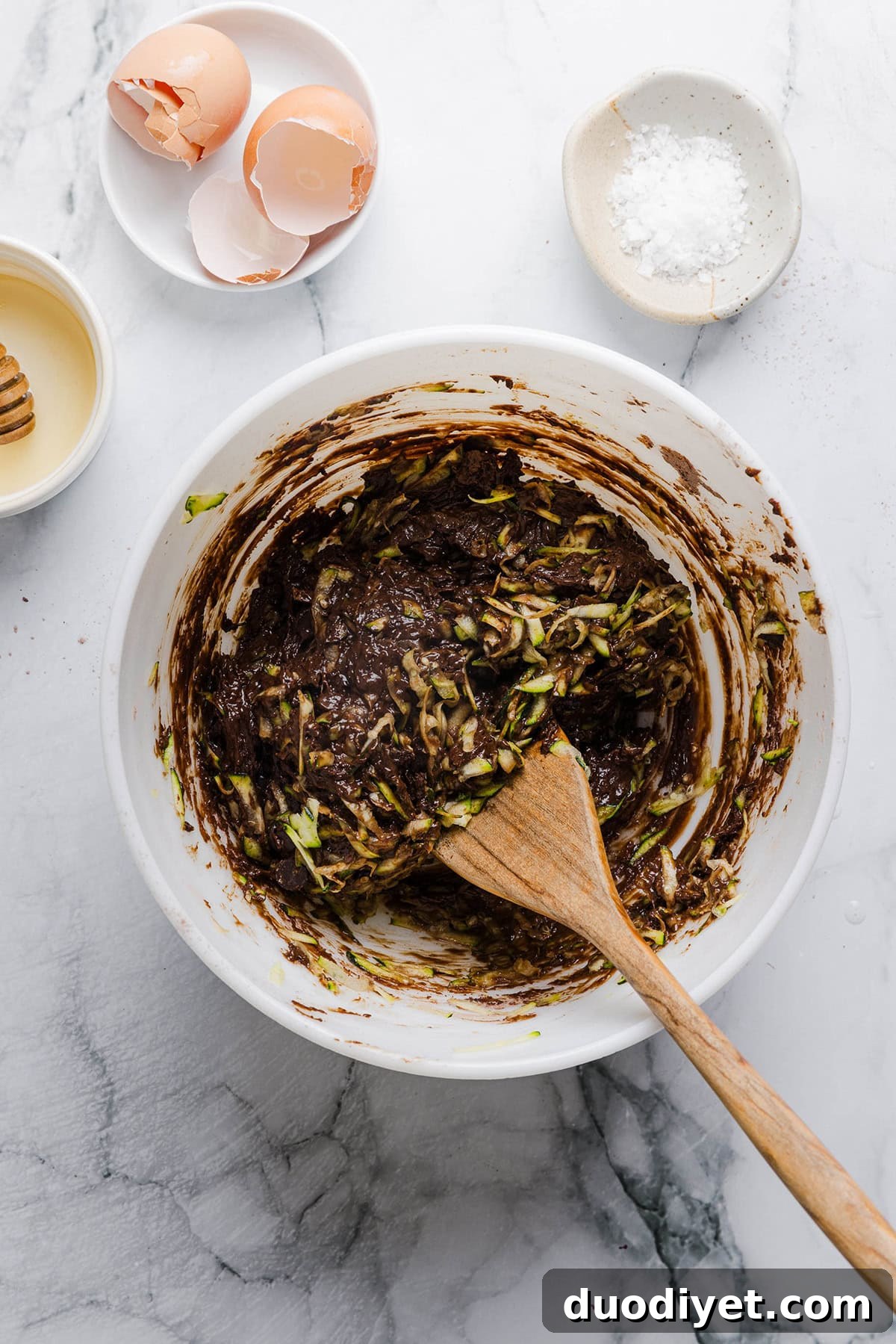 Fudgy Zucchini Brownies Recipe with Rich Chocolate 4 Pan of freshly baked zucchini brownies cooling on a wire rack