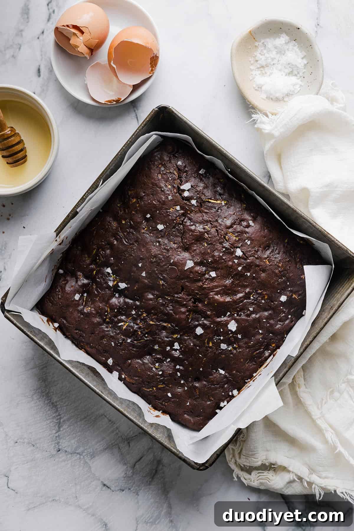 Fudgy Zucchini Brownies Recipe with Rich Chocolate 5 Square of zucchini brownie showing fudgy interior