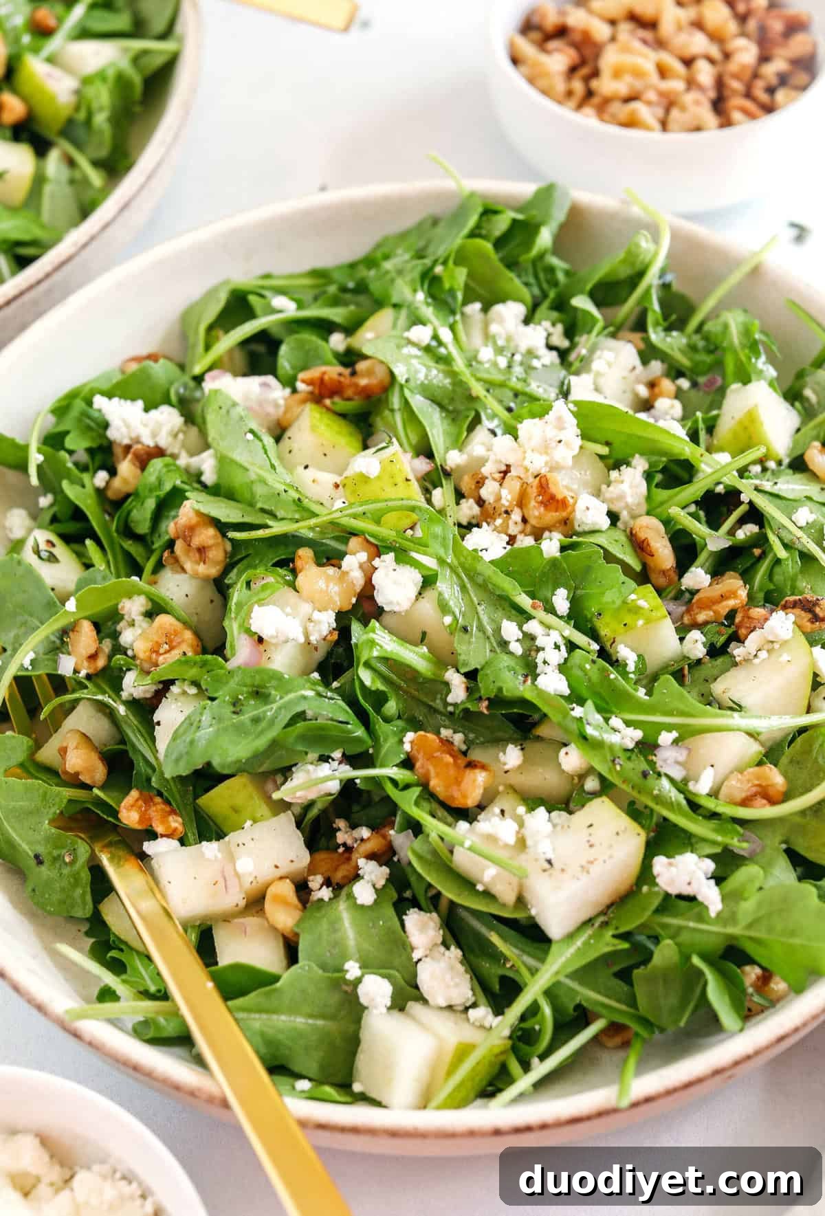 Pear and Arugula Salad Recipe 5 Served pear and arugula salad with walnuts and cheese