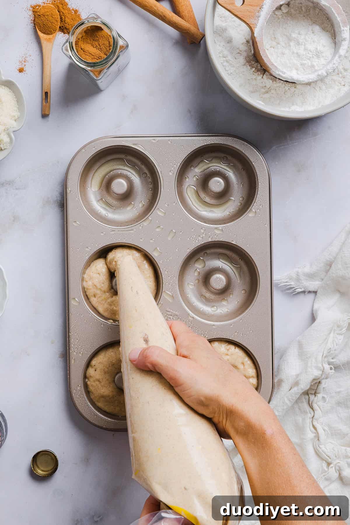 Baked apple cider donuts cooling on a rack