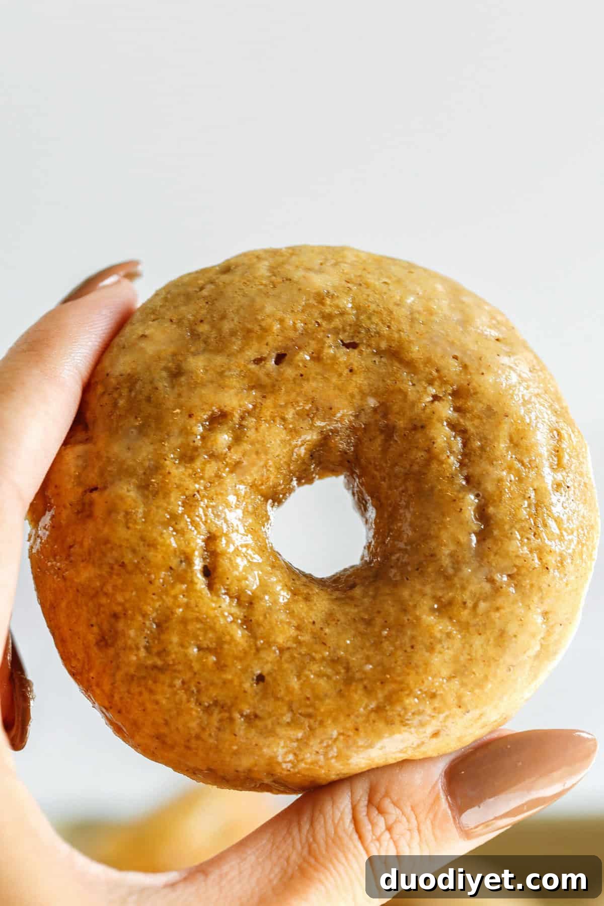 These Baked Banana Bread Donuts are soft, cake-like and made healthier with whole wheat flour, applesauce and zero refined sugar for the perfect morning treat that comes together in just 20 minutes! Such a great way to use up those overripe bananas!