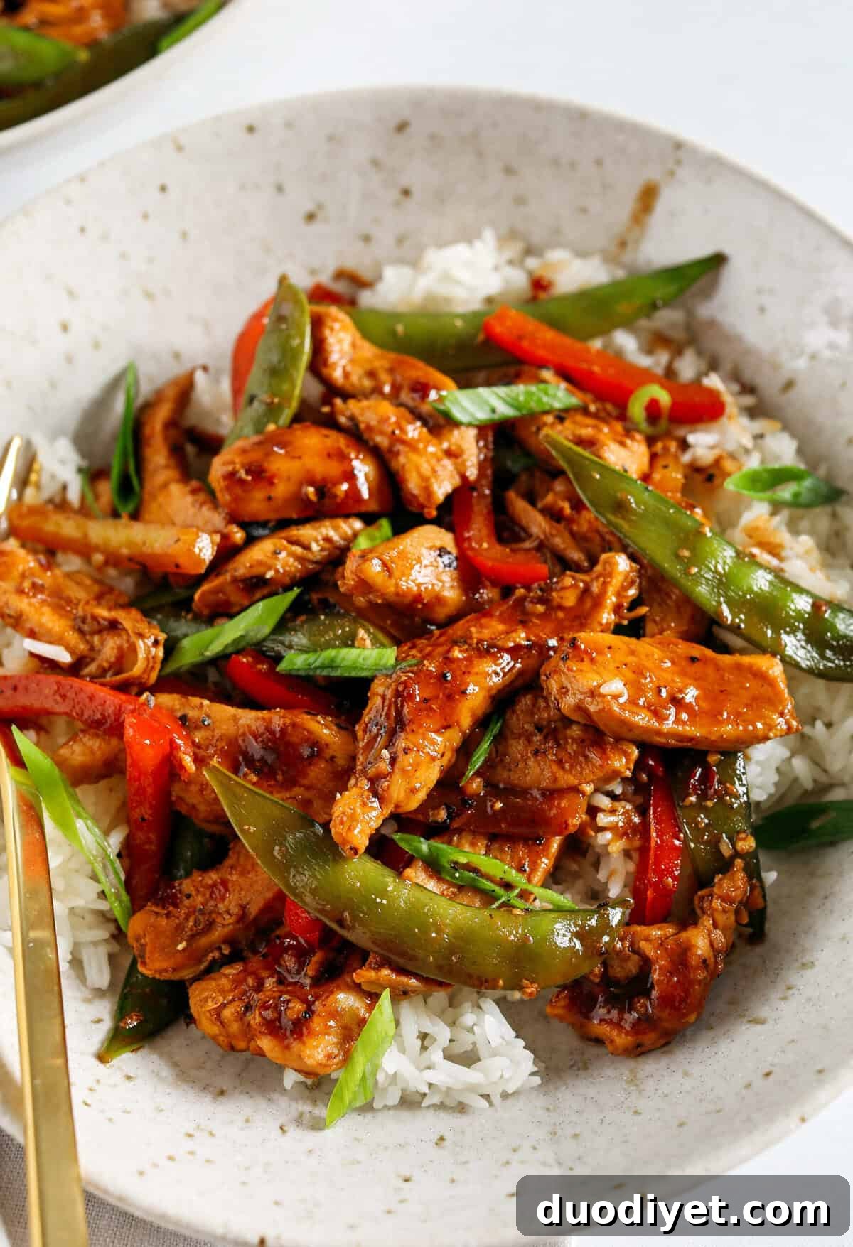 This sweet and spicy Firecracker Chicken Stir Fry is the perfect weeknight meal with tender, juicy chicken, crisp vegetables, all smothered in a delicious sauce that tastes way better than take-out! Serve over rice and have dinner on your table in under 30 minutes!