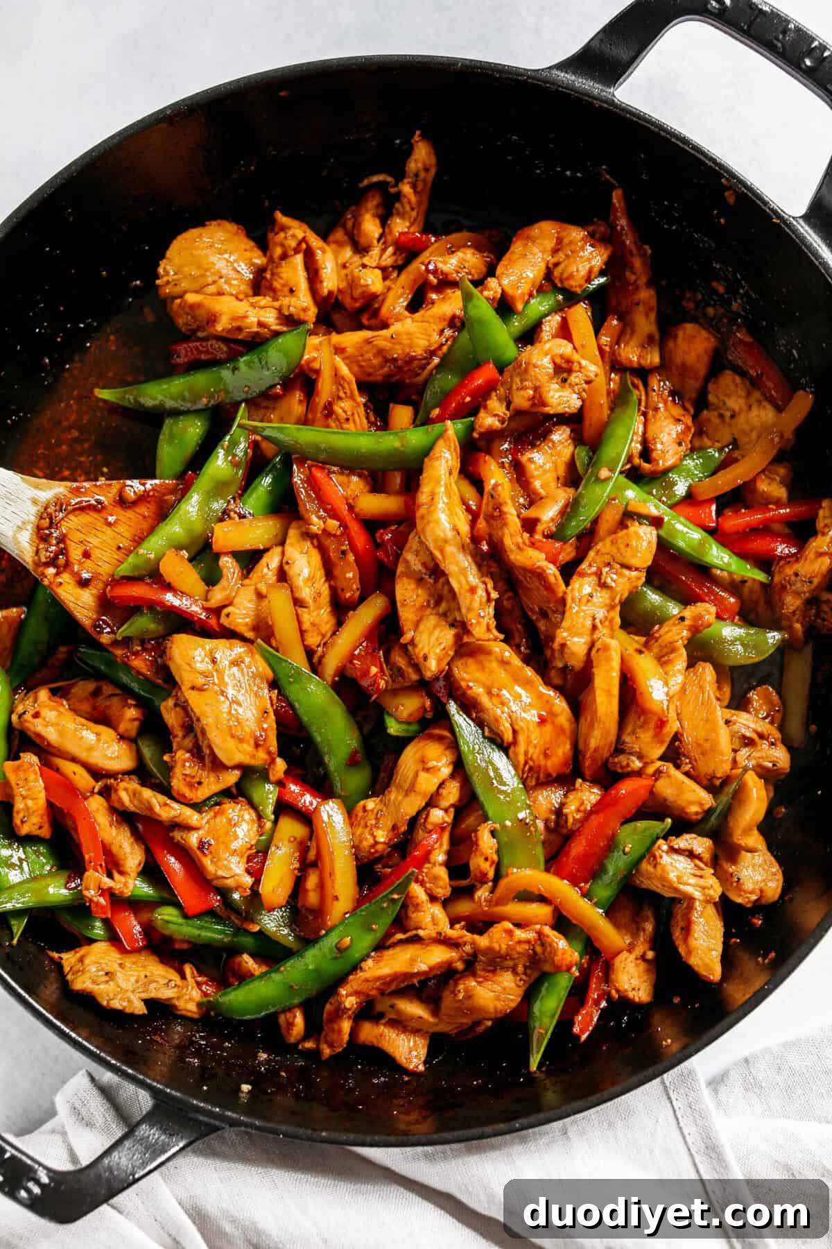 This sweet and spicy Firecracker Chicken Stir Fry is the perfect weeknight meal with tender, juicy chicken, crisp vegetables, all smothered in a delicious sauce that tastes way better than take-out! Serve over rice and have dinner on your table in under 30 minutes!
