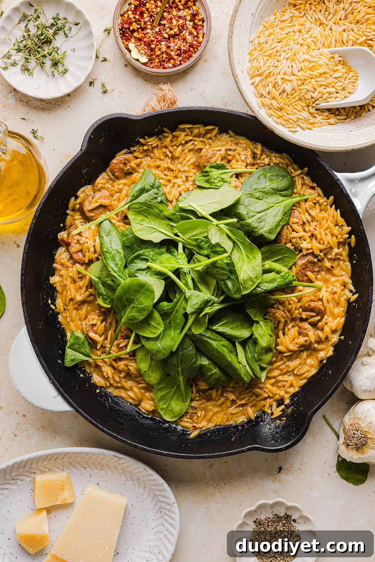 One-Pan Creamy Chicken Sausage and Orzo Skillet 5 Orzo toasting in the pan with garlic and sausage