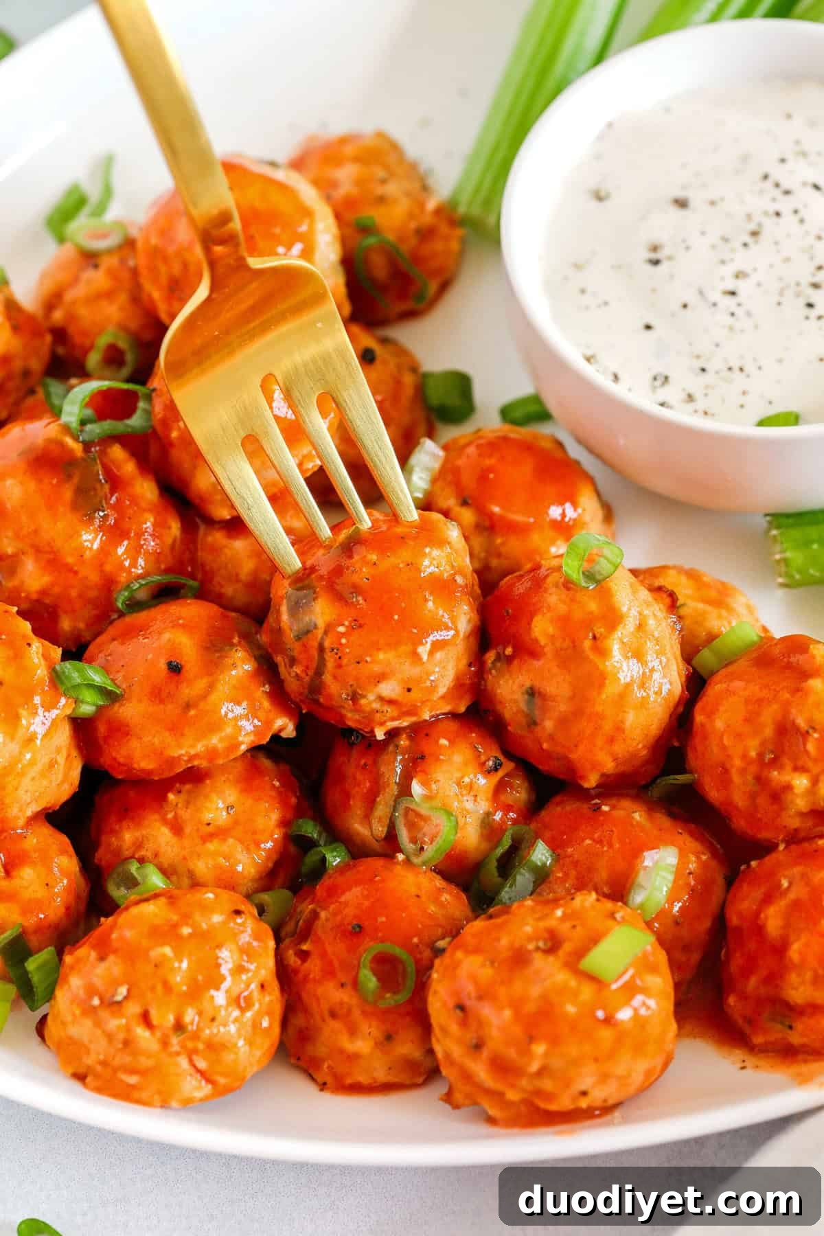 Buffalo Chicken Meatballs served with fresh vegetables and dipping sauce