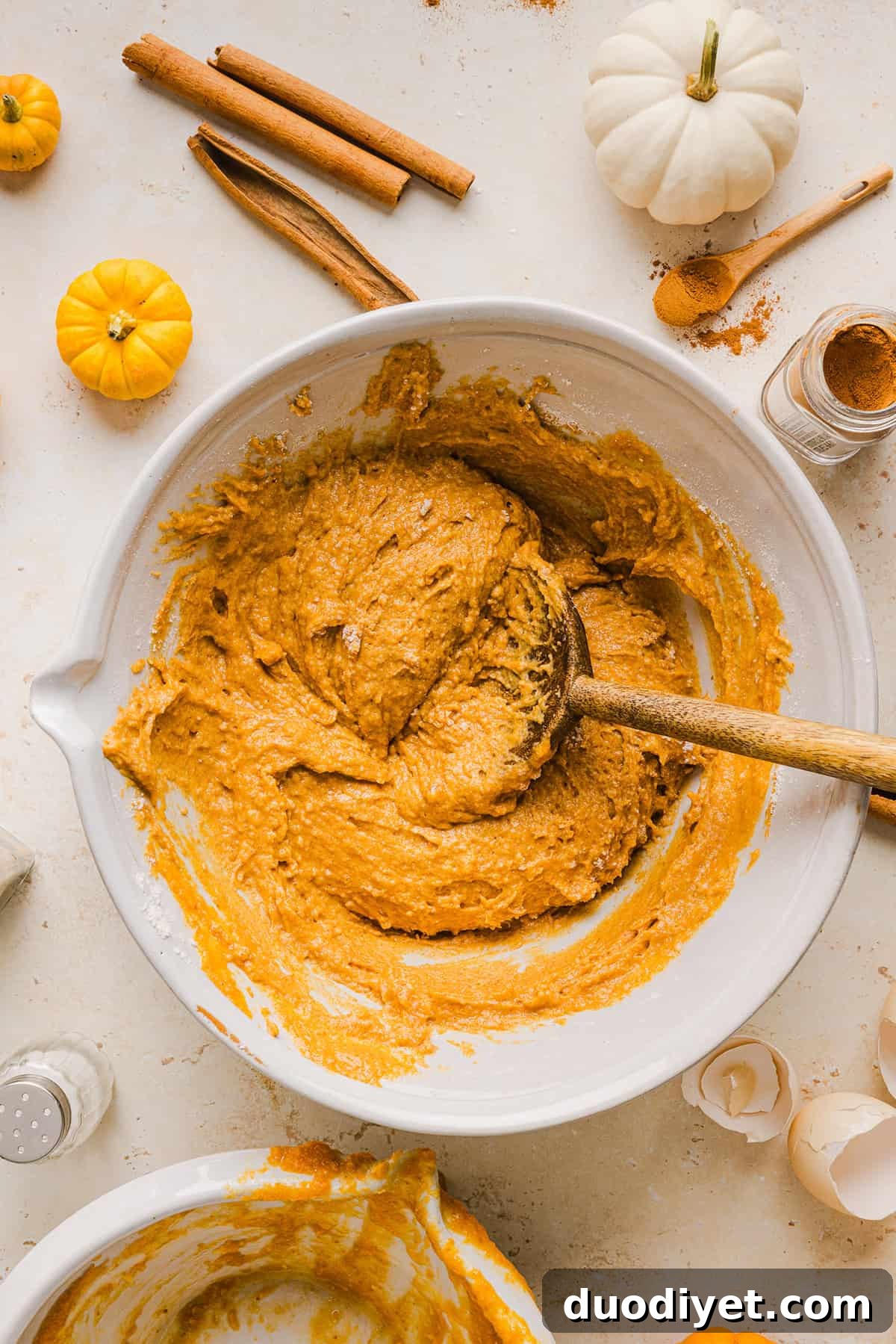 The BEST Healthy Pumpkin Bread that is moist, loaded with pumpkin flavor and made without any butter or refined sugar! Topped with a delicious maple cream cheese glaze for the perfect fall treat this season!