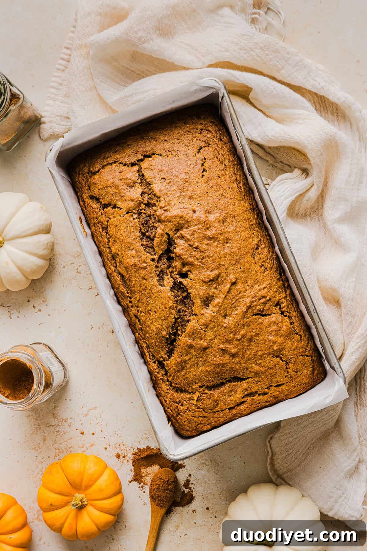 The BEST Healthy Pumpkin Bread that is moist, loaded with pumpkin flavor and made without any butter or refined sugar! Topped with a delicious maple cream cheese glaze for the perfect fall treat this season!