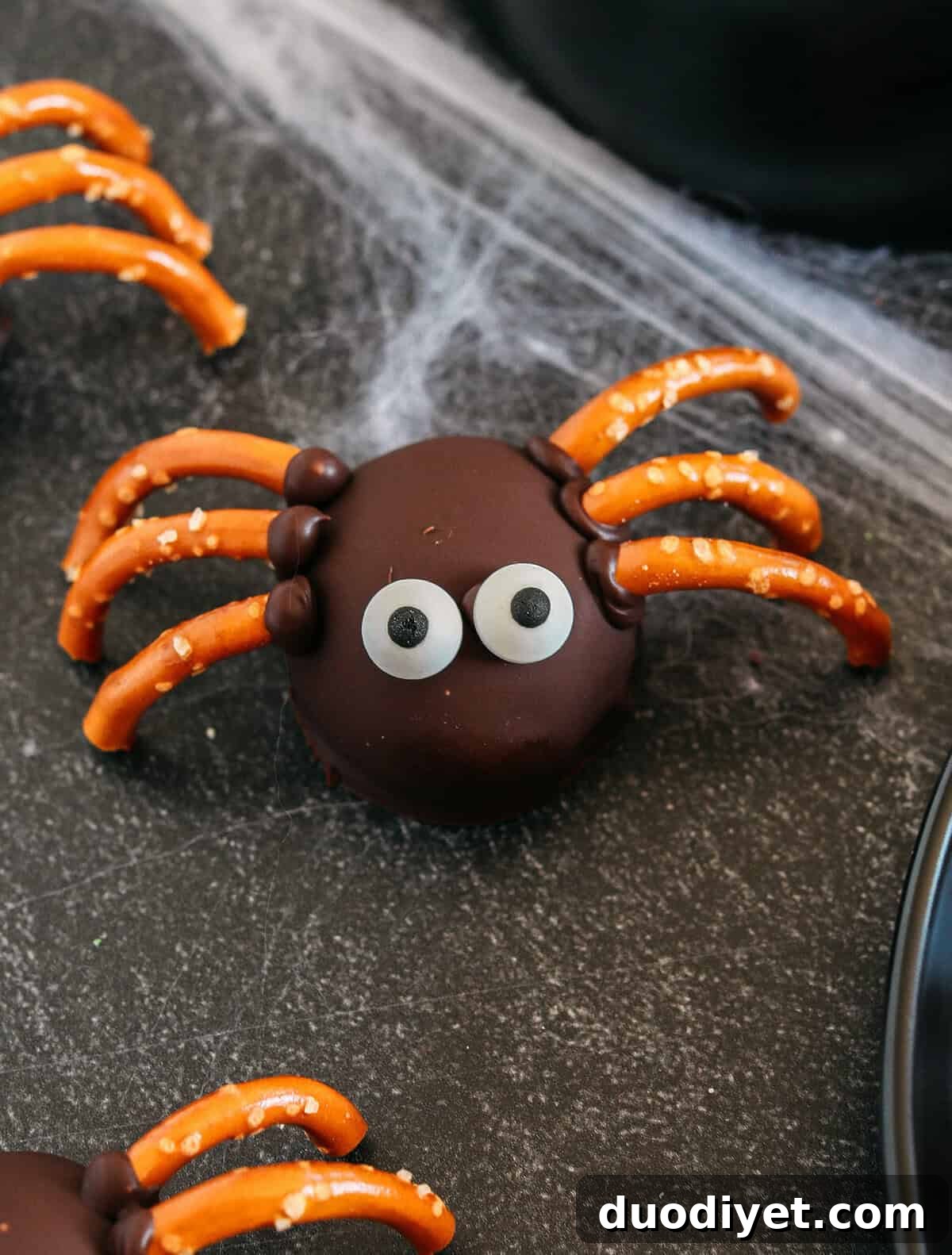Get festive this Halloween with these tasty Chocolate Peanut Butter Spider Balls made with just 5 simple ingredients and zero baking required!  The perfect sweet and salty treats that are easy to make and your kids will love!