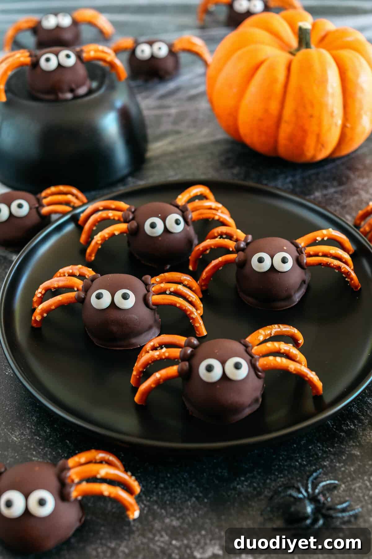 Get festive this Halloween with these tasty Chocolate Peanut Butter Spider Balls made with just 5 simple ingredients and zero baking required!  The perfect sweet and salty treats that are easy to make and your kids will love!
