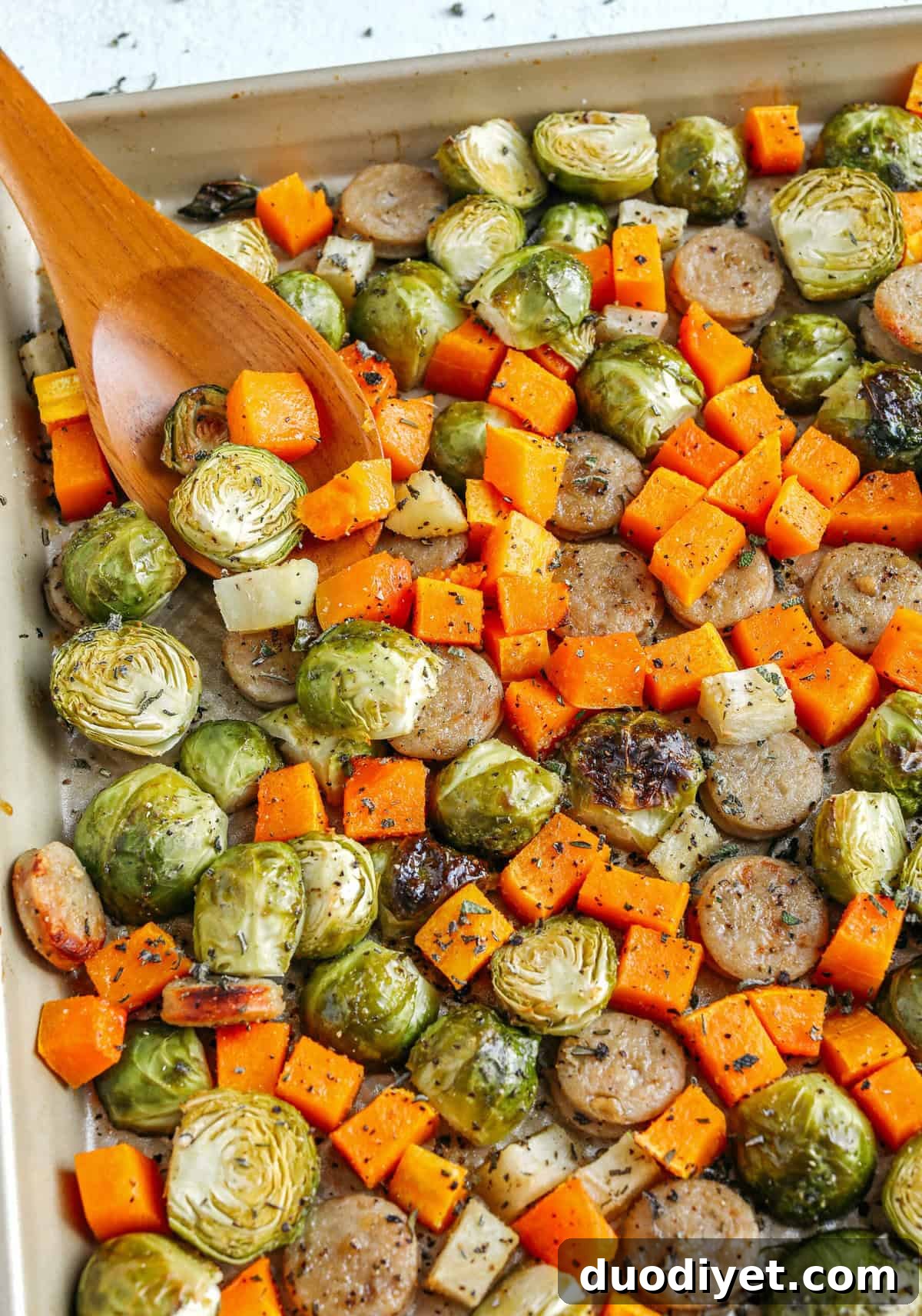 Harvest Sheet Pan Sausage and Veggies loaded with flavorful chicken sausage, butternut squash, brussels sprouts, and apples for a quick and easy dinner made in just 30 minutes!
