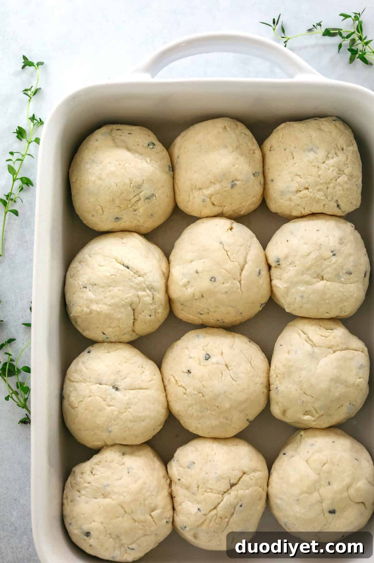 Soft Homemade Honey Butter Dinner Rolls Recipe 4 A pan of freshly baked pull-apart dinner rolls brushed with honey butter.
