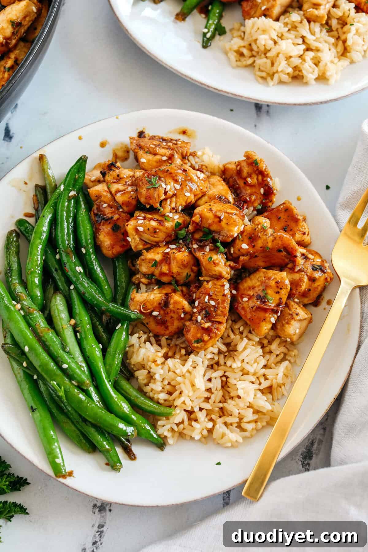 Super flavorful Honey Garlic Chicken and Green Beans make the perfect weeknight meal smothered in a delicious sauce that tastes way better than take-out!  Serve over rice and have dinner on your table in under 30 minutes! 