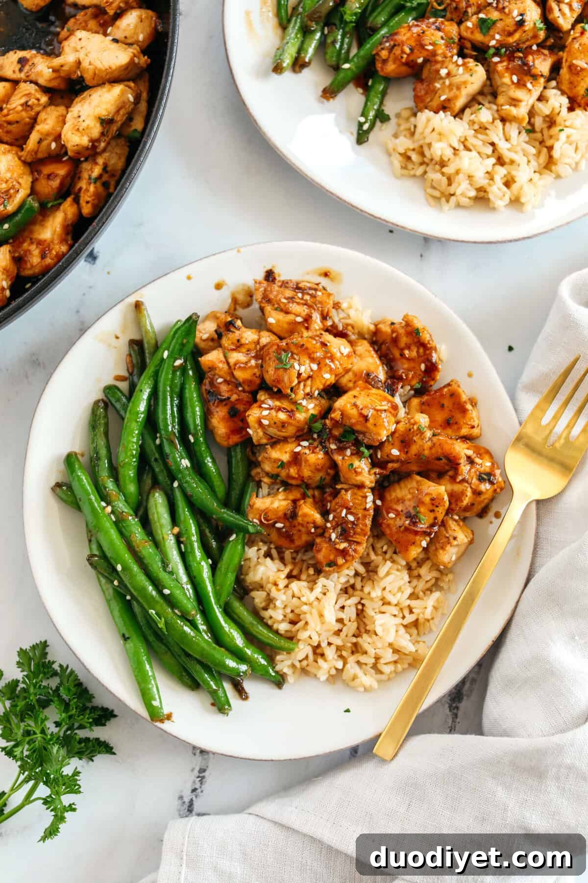 Super flavorful Honey Garlic Chicken and Green Beans make the perfect weeknight meal smothered in a delicious sauce that tastes way better than take-out!  Serve over rice and have dinner on your table in under 30 minutes! 