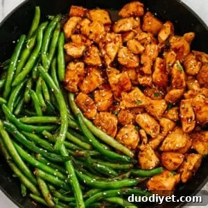 Plate of honey garlic chicken and green beans over rice