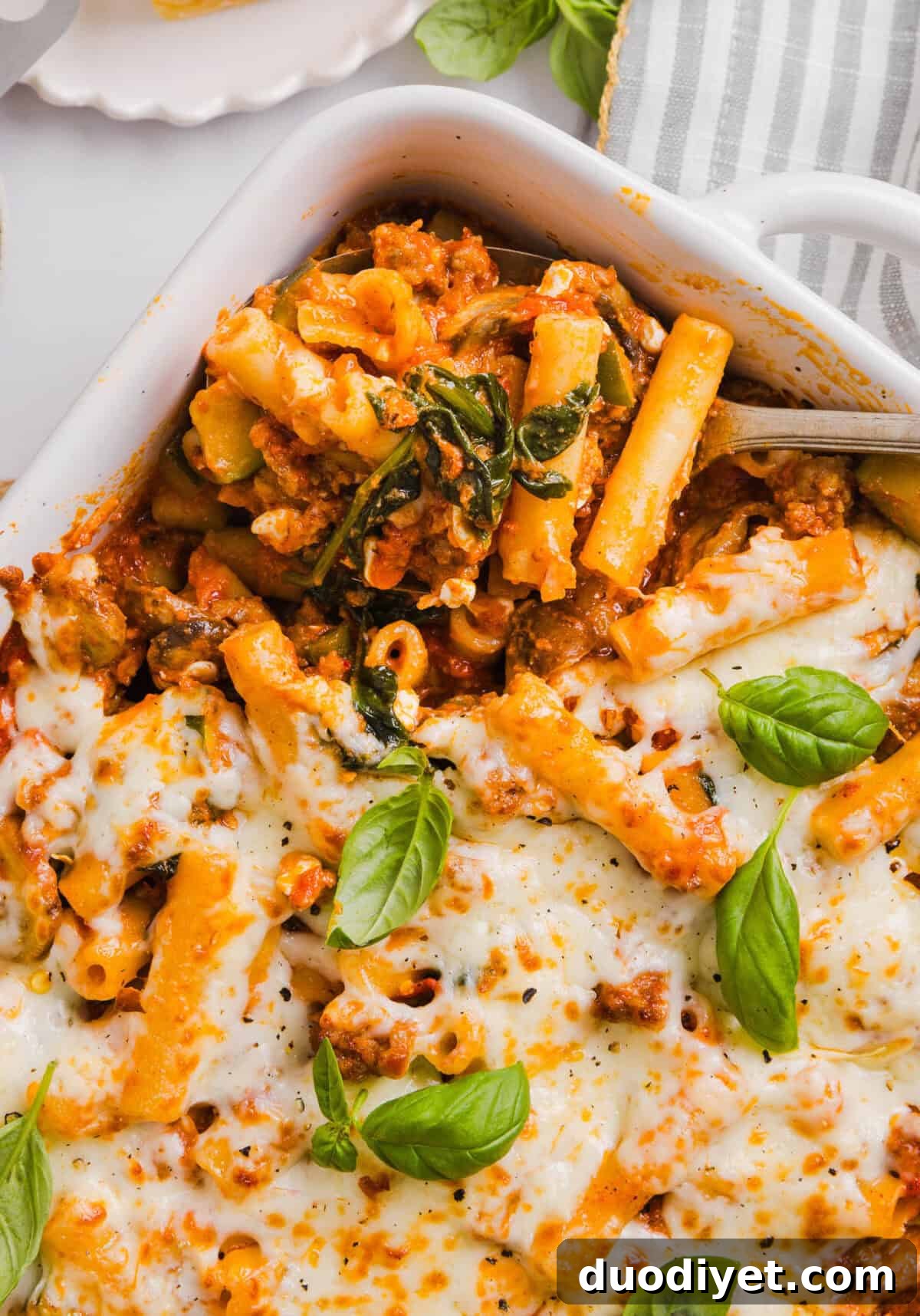 Wholesome Baked Ziti Recipe with Spinach and Ricotta 2 This comforting and delicious Healthy Baked Ziti recipe is packed with fresh veggies, flavorful turkey sausage and makes the perfect weeknight meal the whole family will love! Leftovers guaranteed!
