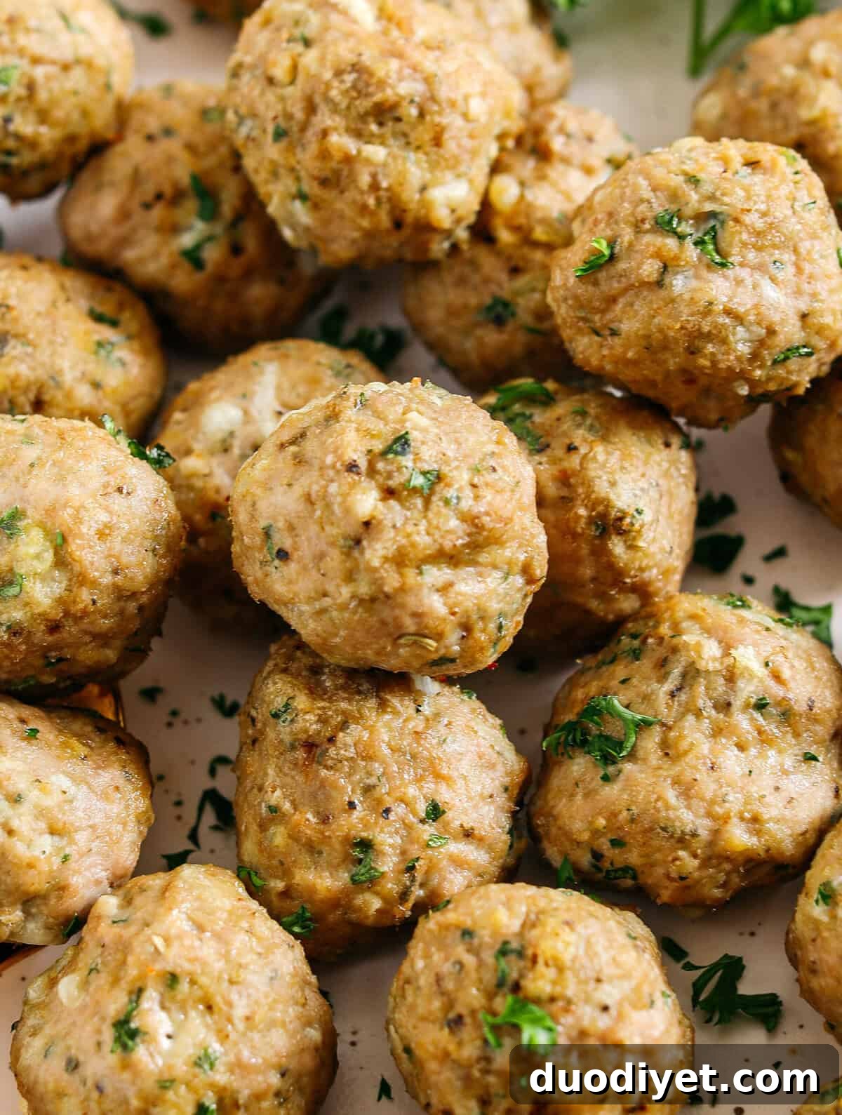 Juicy Turkey Meatball Recipe with Garlic and Herbs 3 Baked turkey meatballs ready to serve