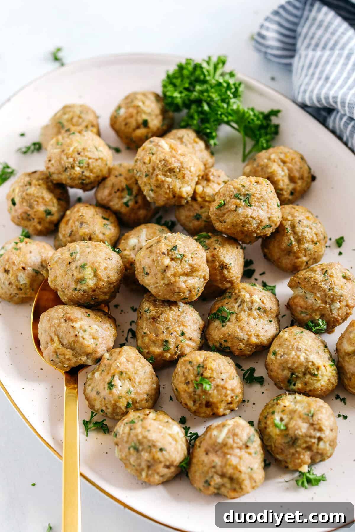 These Easy Turkey Meatballs are tender, juicy and packed with flavor!  Made with just a few simple ingredients in under 30 minutes, these baked homemade meatballs can be added to any favorite dish!