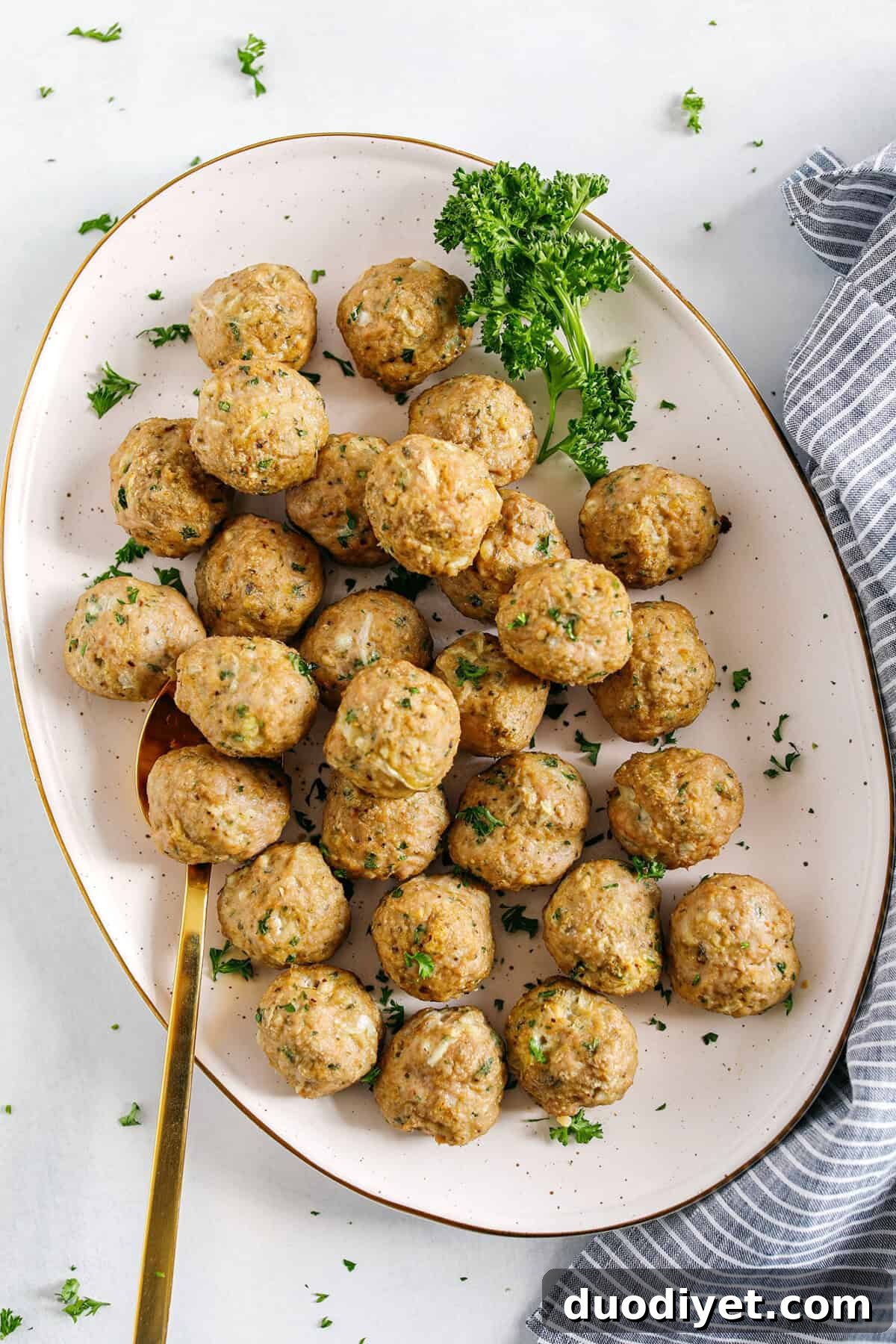 These Easy Turkey Meatballs are tender, juicy and packed with flavor!  Made with just a few simple ingredients in under 30 minutes, these baked homemade meatballs can be added to any favorite dish!