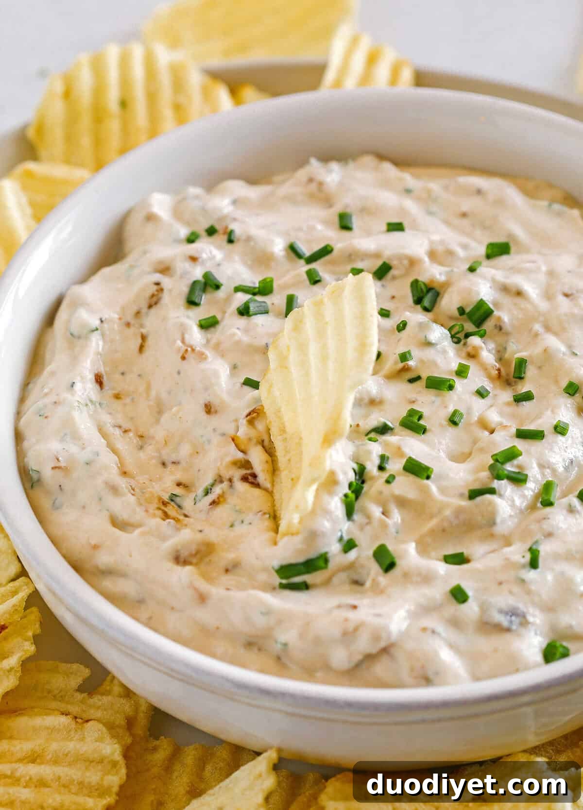 Delicious High Protein French Onion Dip made healthier with protein-packed cottage cheese, caramelized onions, and fresh herbs for the perfect dip to serve with chips, veggies and crackers!