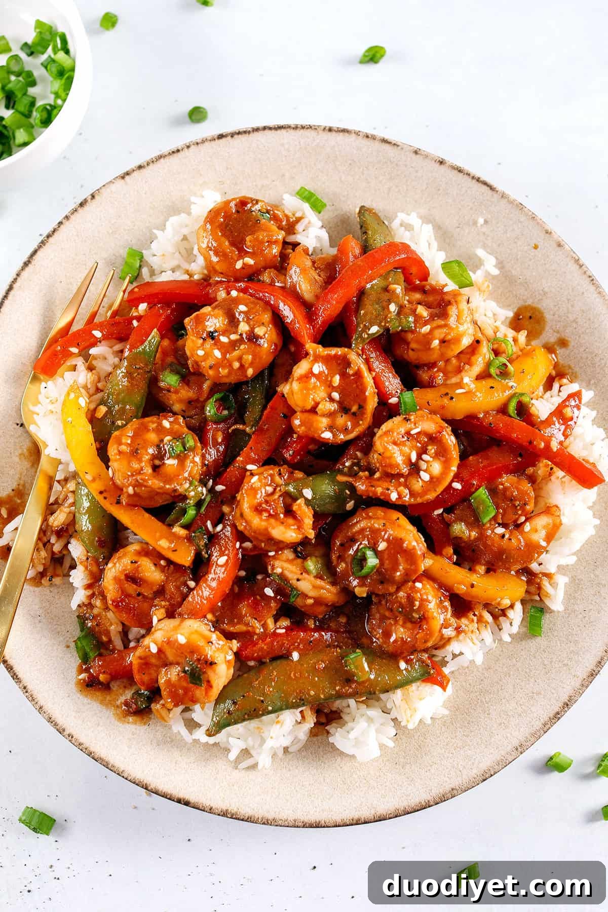 Spicy Firecracker Shrimp Stir-Fry Recipe 3 Plated Firecracker Shrimp Stir Fry ready to serve over rice.