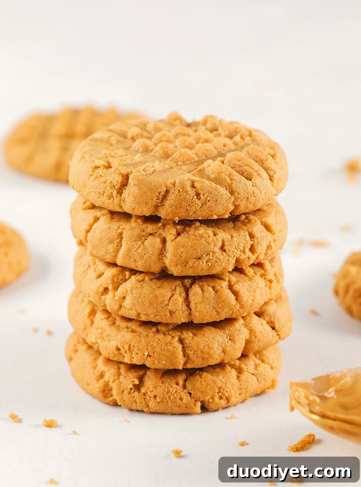 The BEST 5-Ingredient Peanut Butter Cookies recipe made with simple pantry ingredients and zero flour, butter or oil!  Soft, chewy cookies with rich peanut butter flavor are the perfect gluten-free sweet treat.
