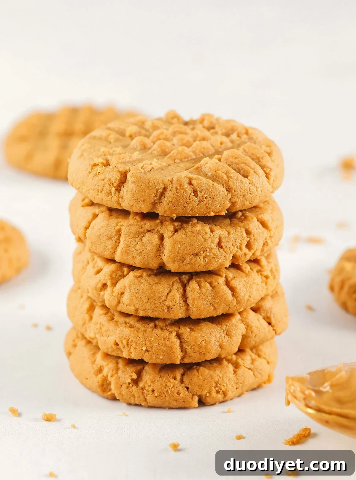 Golden peanut butter cookies with a classic fork crisscross.