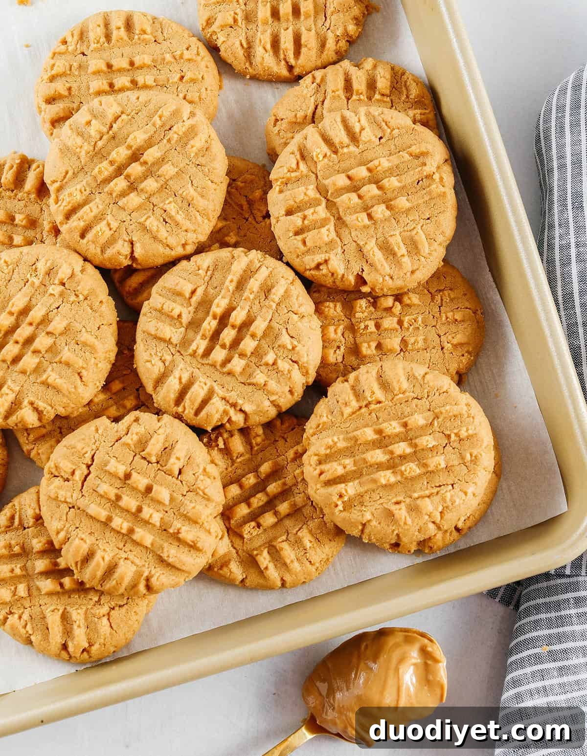 The BEST 5-Ingredient Peanut Butter Cookies recipe made with simple pantry ingredients and zero flour, butter or oil!  Soft, chewy cookies with rich peanut butter flavor are the perfect gluten-free sweet treat.