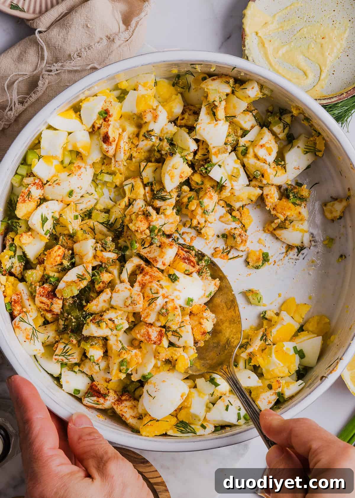 This Healthy Egg Salad recipe is packed with protein, fresh flavors and made healthier with Greek yogurt in place of mayo! Enjoy this on a sandwich, lettuce wrap, with crackers or straight from the bowl!