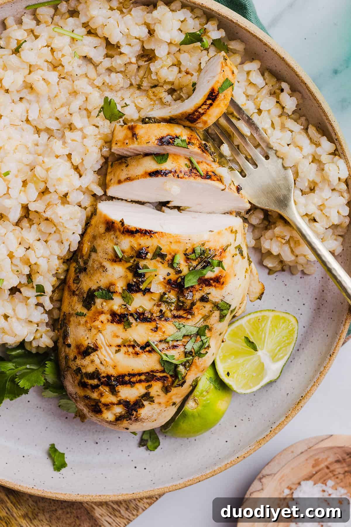 Cilantro lime chicken served with lime wedges