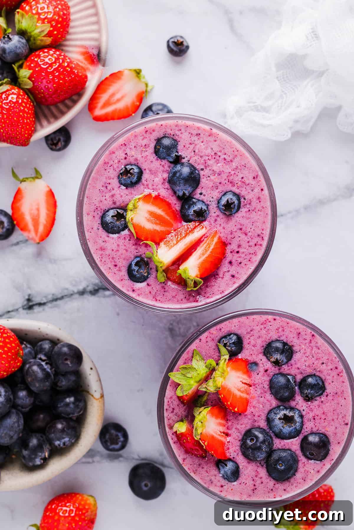 Creamy Mixed Berry Smoothie Recipe 7 Glass jars with mixed berry smoothies ready to enjoy