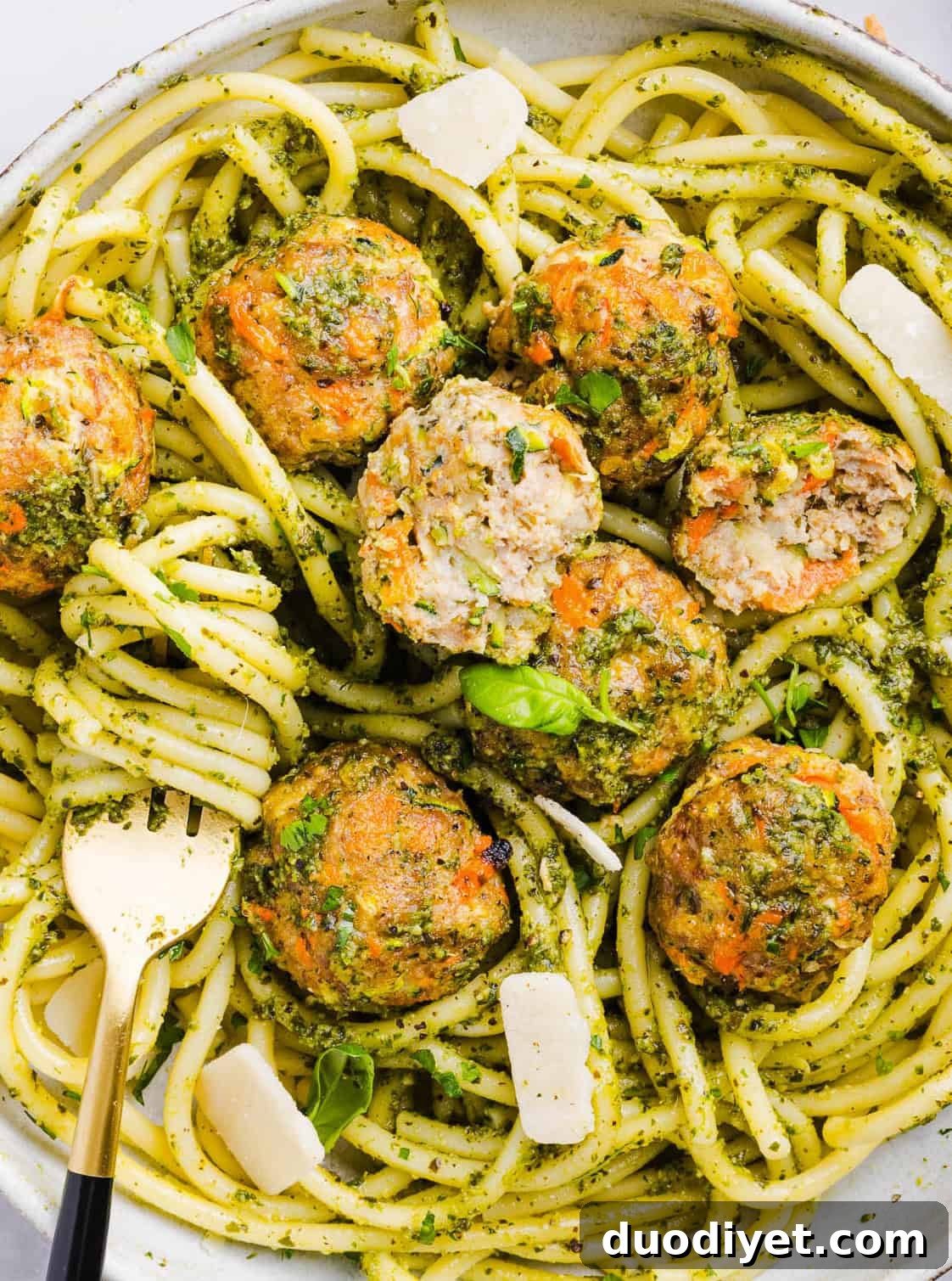 Oven-Baked Chicken Pesto Meatballs 5 Mouthwatering Baked Chicken Pesto Meatballs made with tender ground chicken, garlicky basil pesto, fresh veggies and parmesan cheese. Juicy, flavorful and make the perfect weeknight meal served over pasta or with rice!