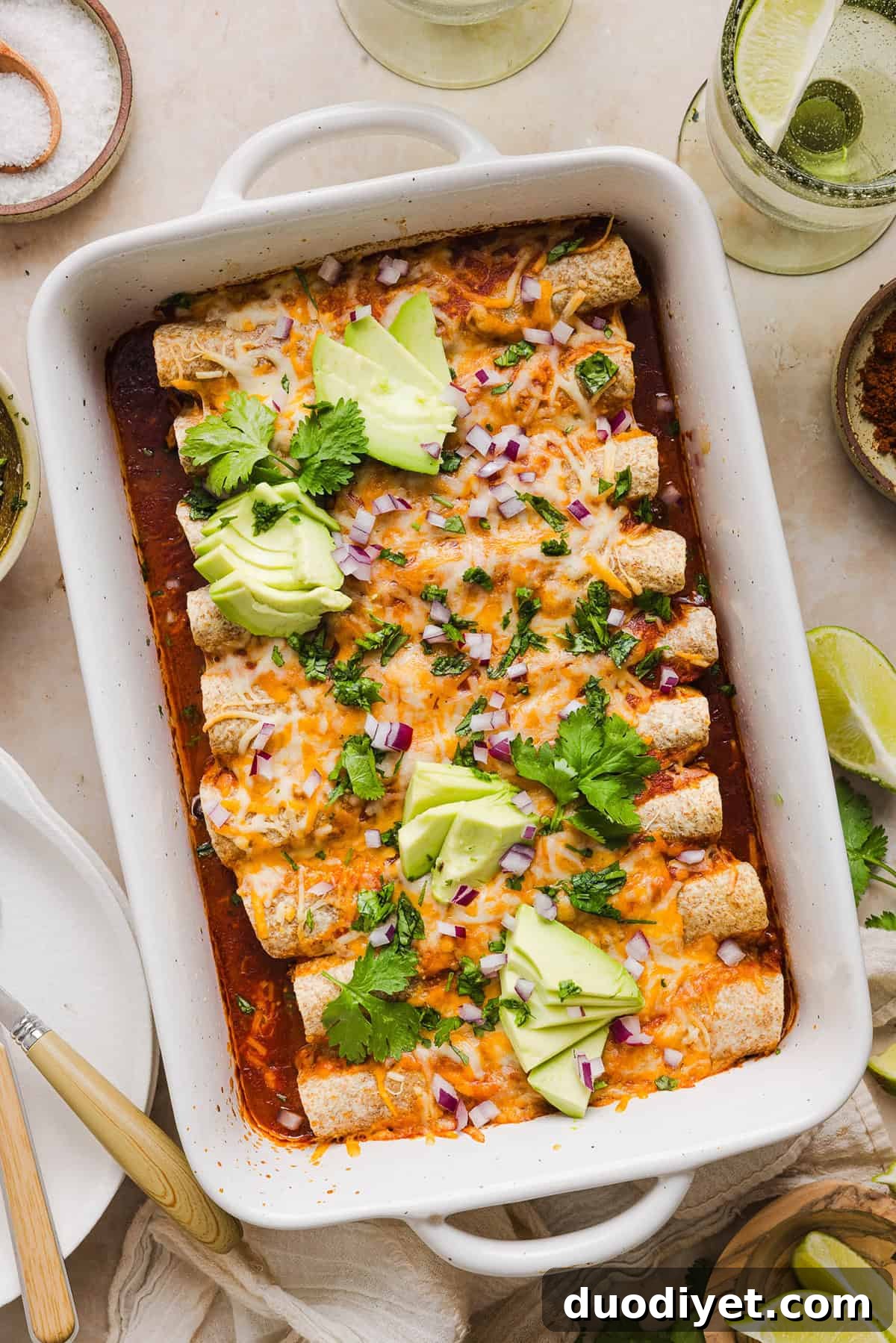 This Healthy Chicken Enchilada recipe is a family favorite made with wholesome, flavorful ingredients for the perfect weeknight meal! The homemade enchilada sauce tastes absolutely amazing! 