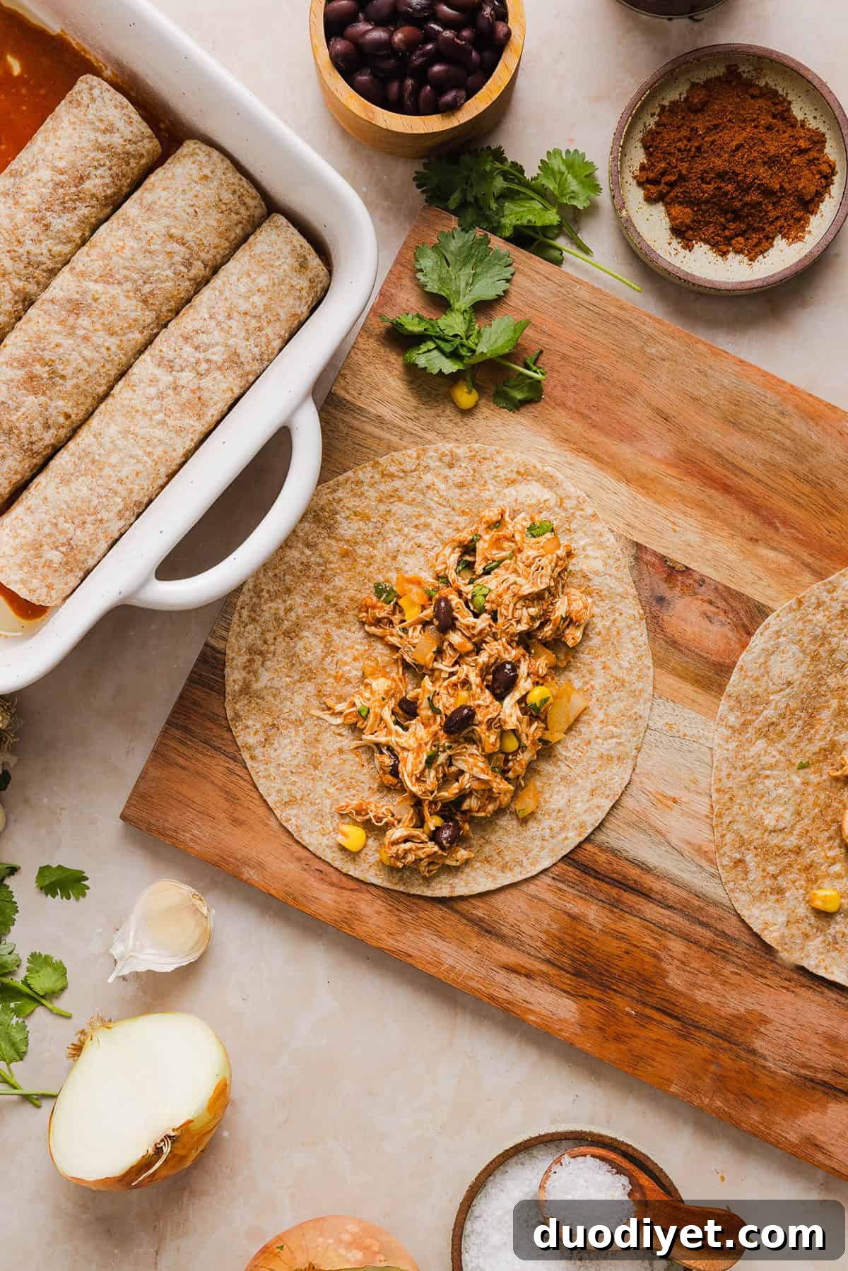 This Healthy Chicken Enchilada recipe is a family favorite made with wholesome, flavorful ingredients for the perfect weeknight meal! The homemade enchilada sauce tastes absolutely amazing! 