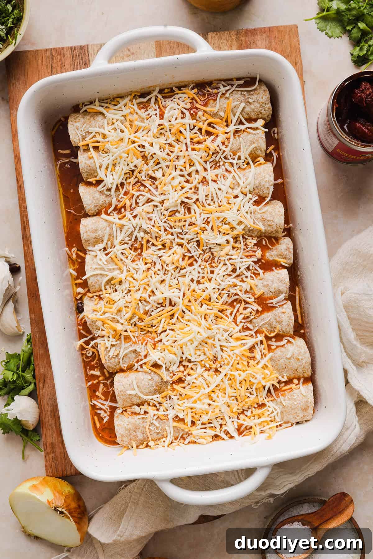 This Healthy Chicken Enchilada recipe is a family favorite made with wholesome, flavorful ingredients for the perfect weeknight meal! The homemade enchilada sauce tastes absolutely amazing! 