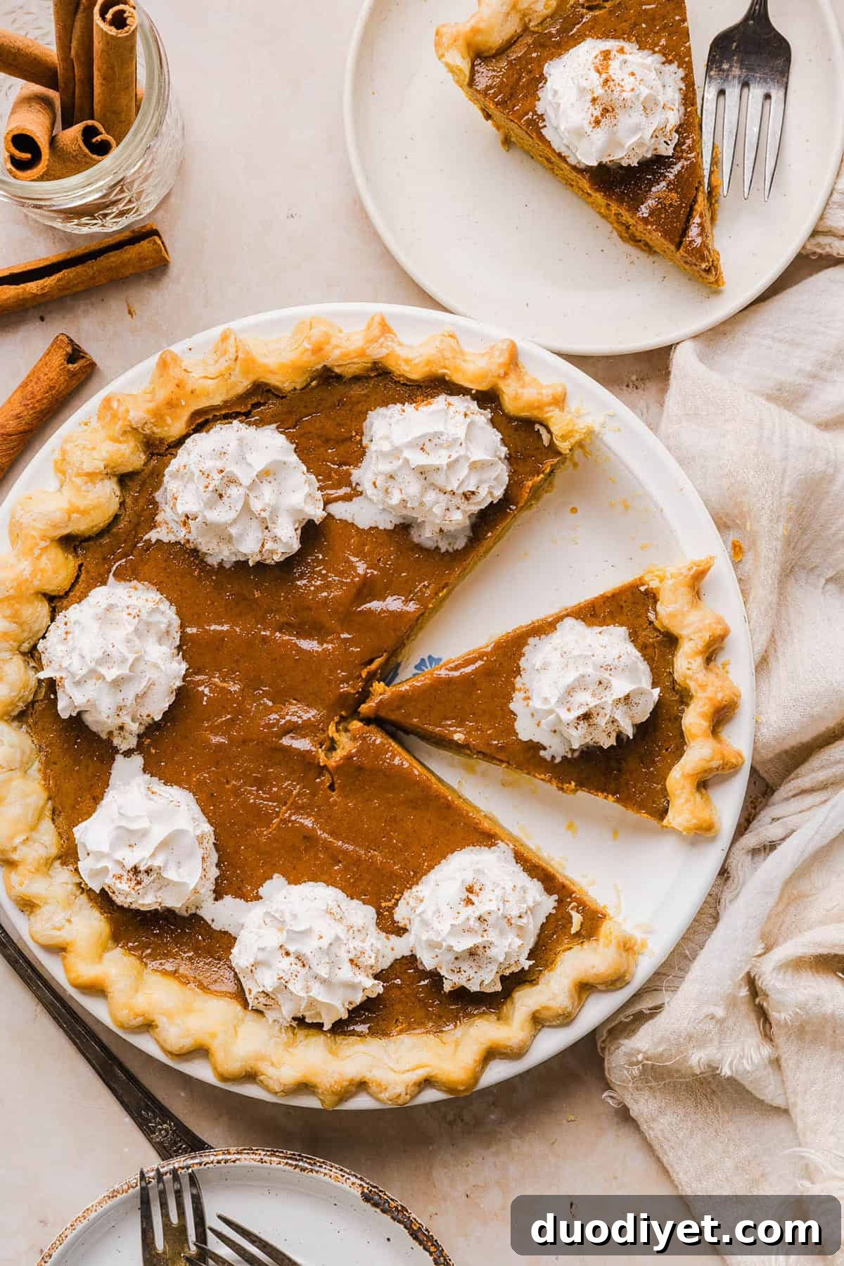 This creamy and delicious Healthy Pumpkin Pie makes the perfect holiday dessert! So easy to make, naturally sweetened with maple syrup and tastes great topped with whipped cream or vanilla ice cream!