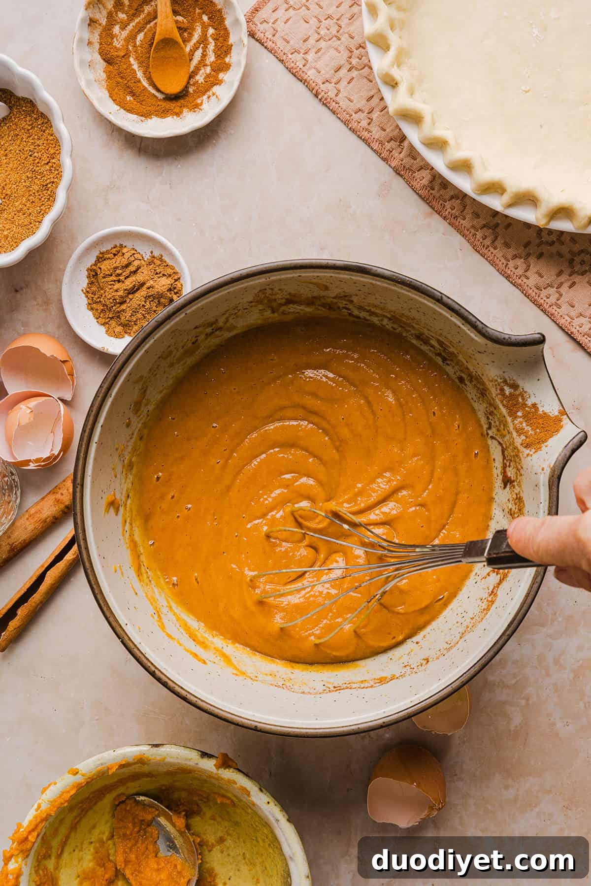 This creamy and delicious Healthy Pumpkin Pie makes the perfect holiday dessert! So easy to make, naturally sweetened with maple syrup and tastes great topped with whipped cream or vanilla ice cream!