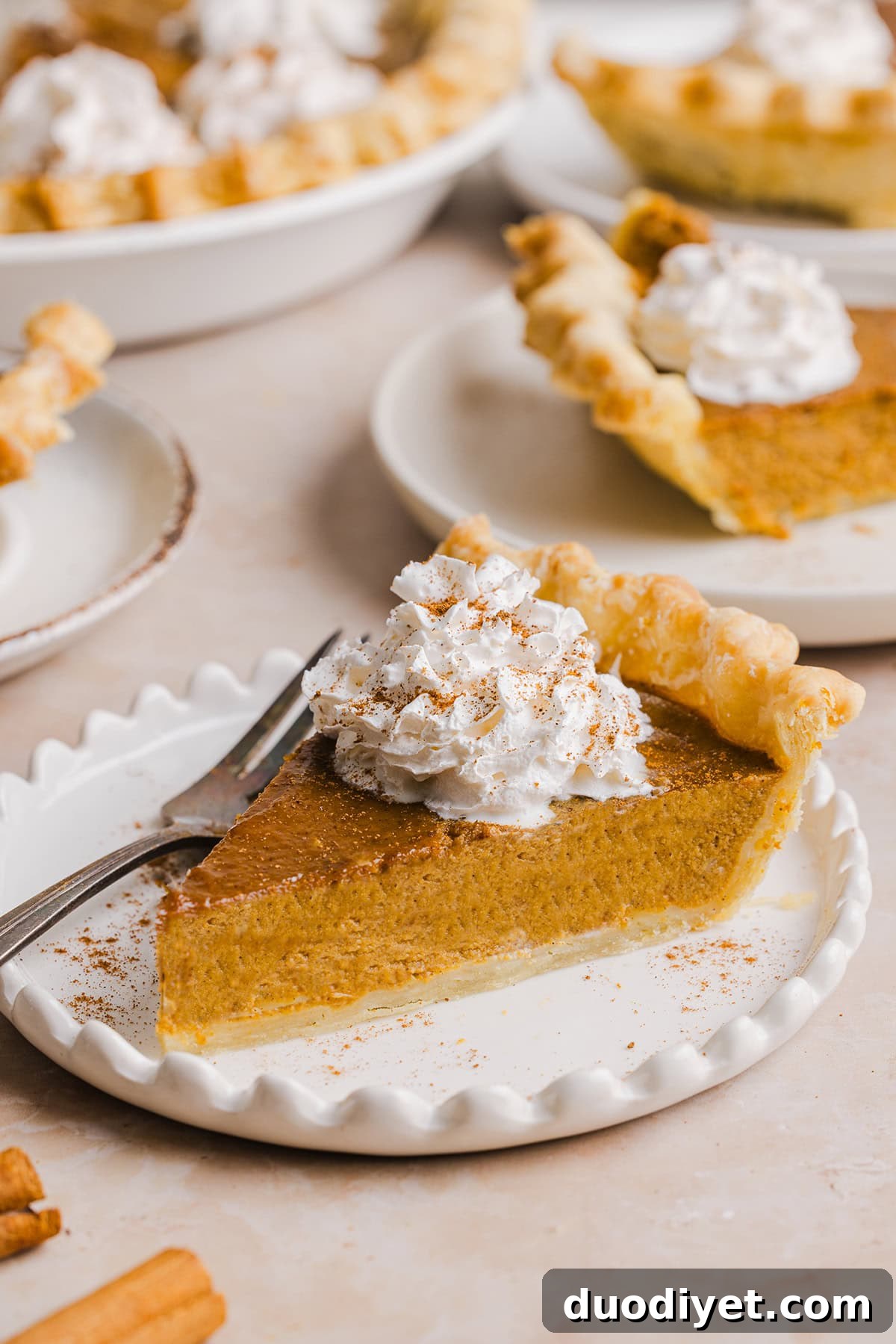 This creamy and delicious Healthy Pumpkin Pie makes the perfect holiday dessert! So easy to make, naturally sweetened with maple syrup and tastes great topped with whipped cream or vanilla ice cream!
