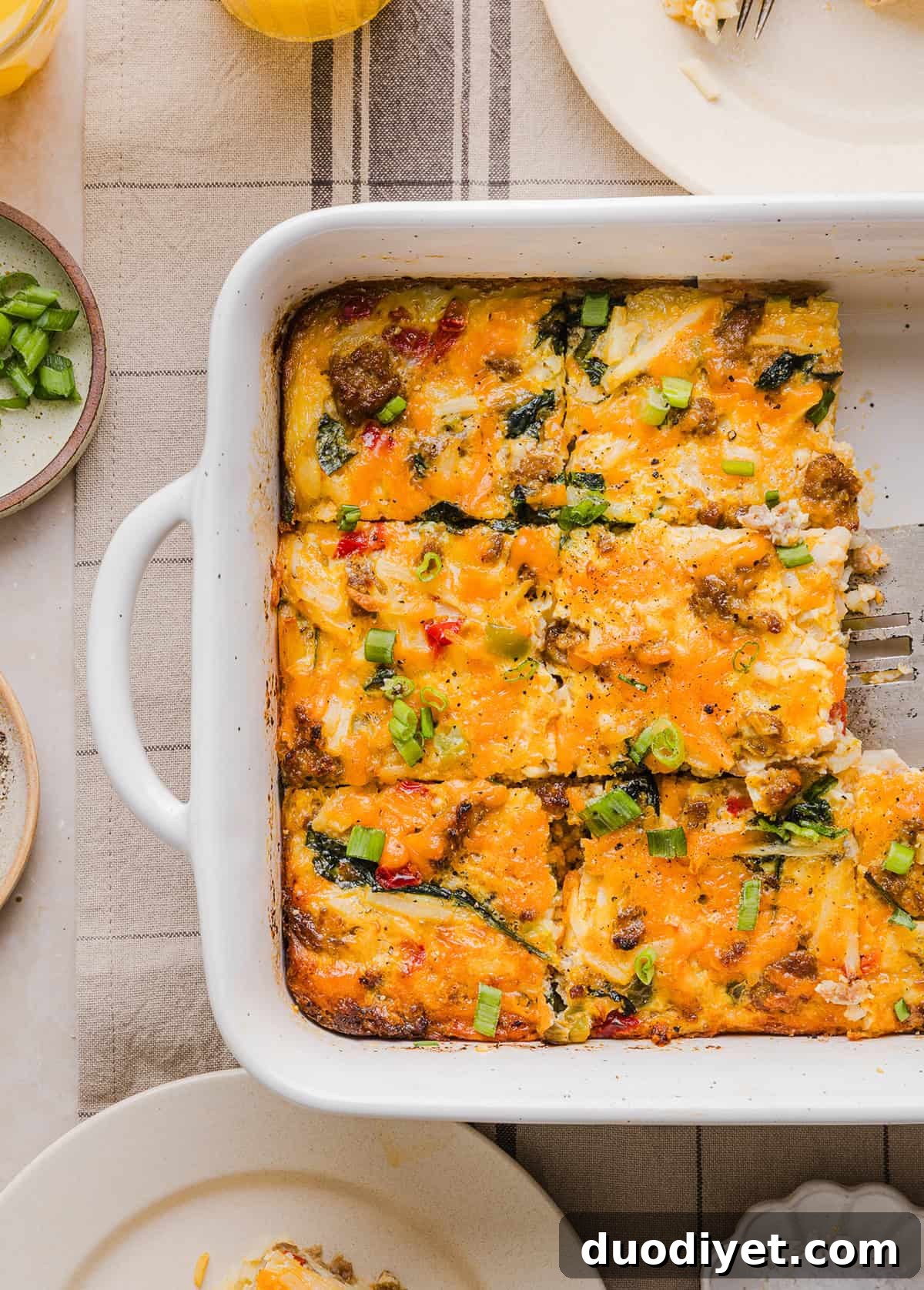 This Easy Hash Brown Breakfast Casserole is loaded with savory sausage, sautéed peppers and onions, along with melty cheese and perfectly seasoned eggs. The perfect recipe for your holiday brunch or weekend breakfast that can easily be prepped the night before!