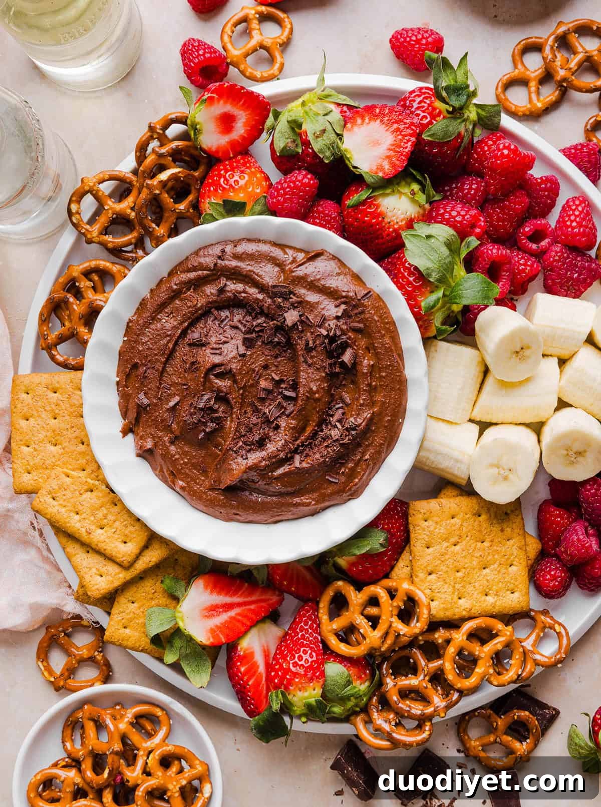 Chocolate Hummus: Creamy Cocoa Chickpea Dip 2 This Healthy Chocolate Hummus is rich and indulgent to satisfy your sweet tooth, but made with wholesome ingredients that you can feel good about eating! Serve with your favorite fruit, pretzels or graham crackers for the perfect fun dessert or snack!
