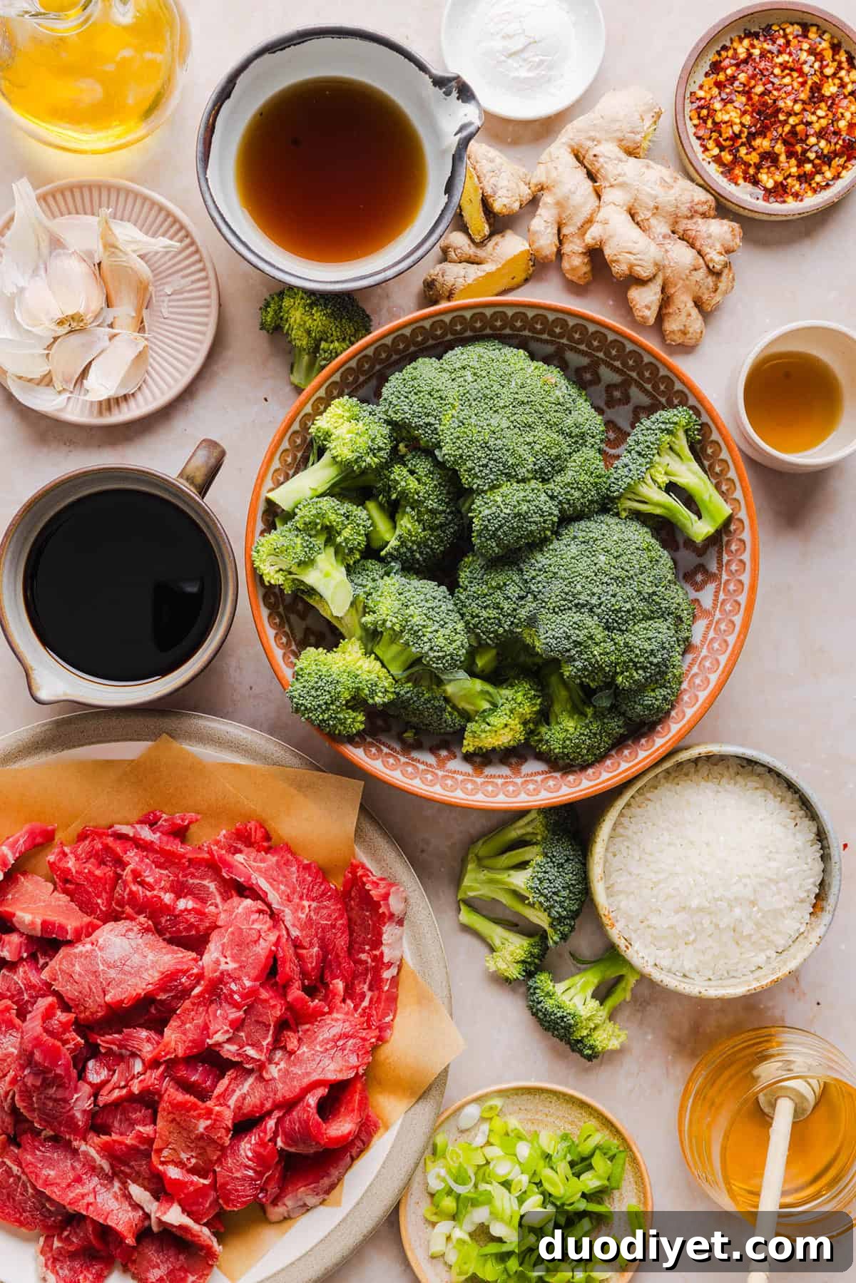 You'll love this Healthy Beef and Broccoli recipe made with tender flank steak, crisp broccoli and a savory garlic ginger sauce.  A quick and easy weeknight dinner that tastes better than take-out and comes together in under 30 minutes!